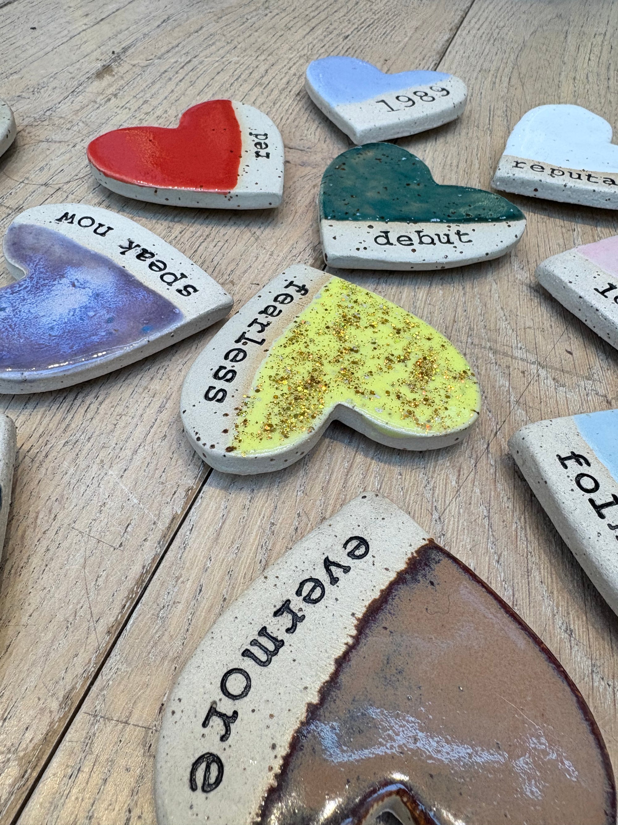Twelve heart shaped Taylor Swift album magnets