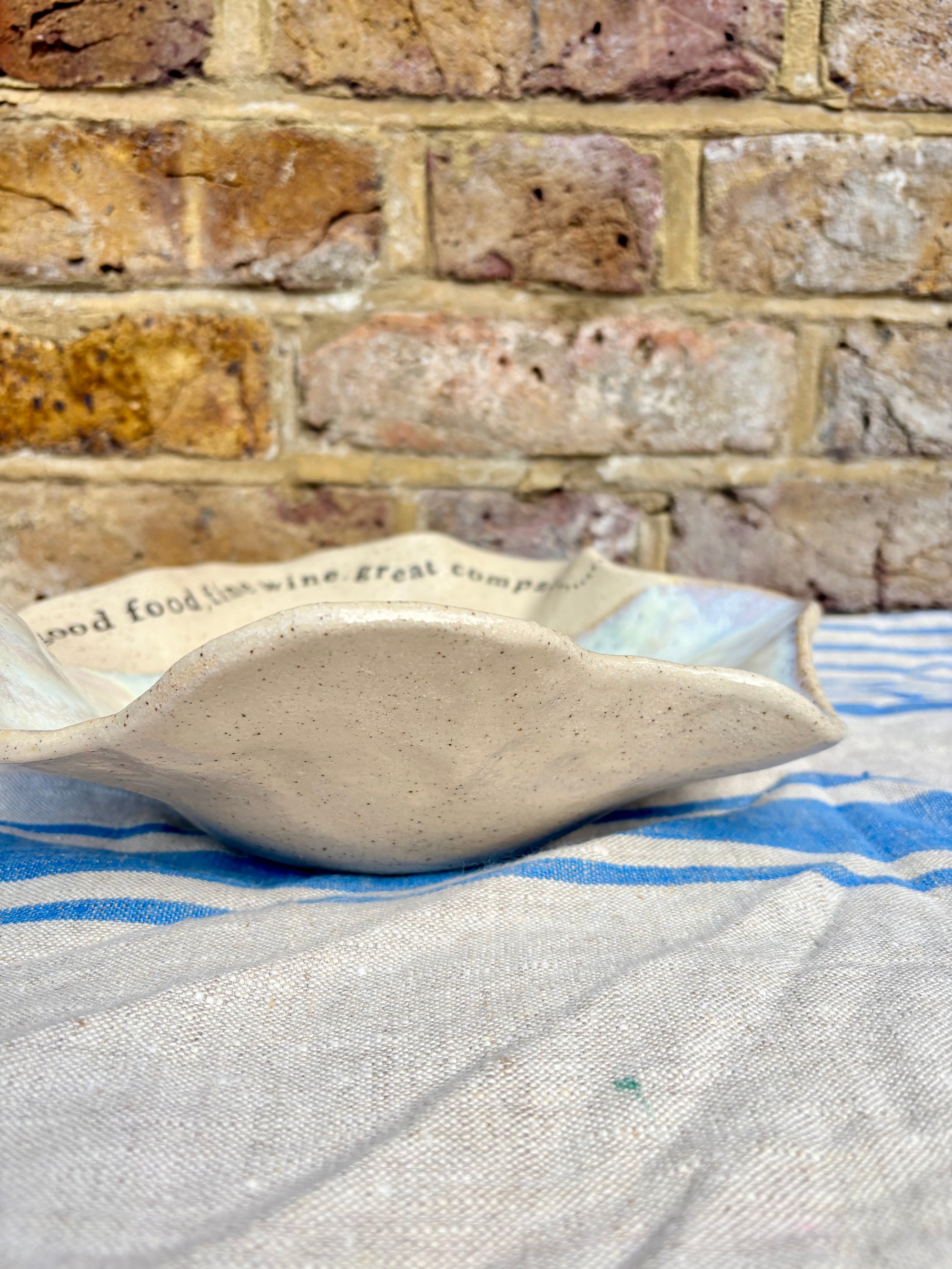 "good food, fine wine, great company..." serving dish