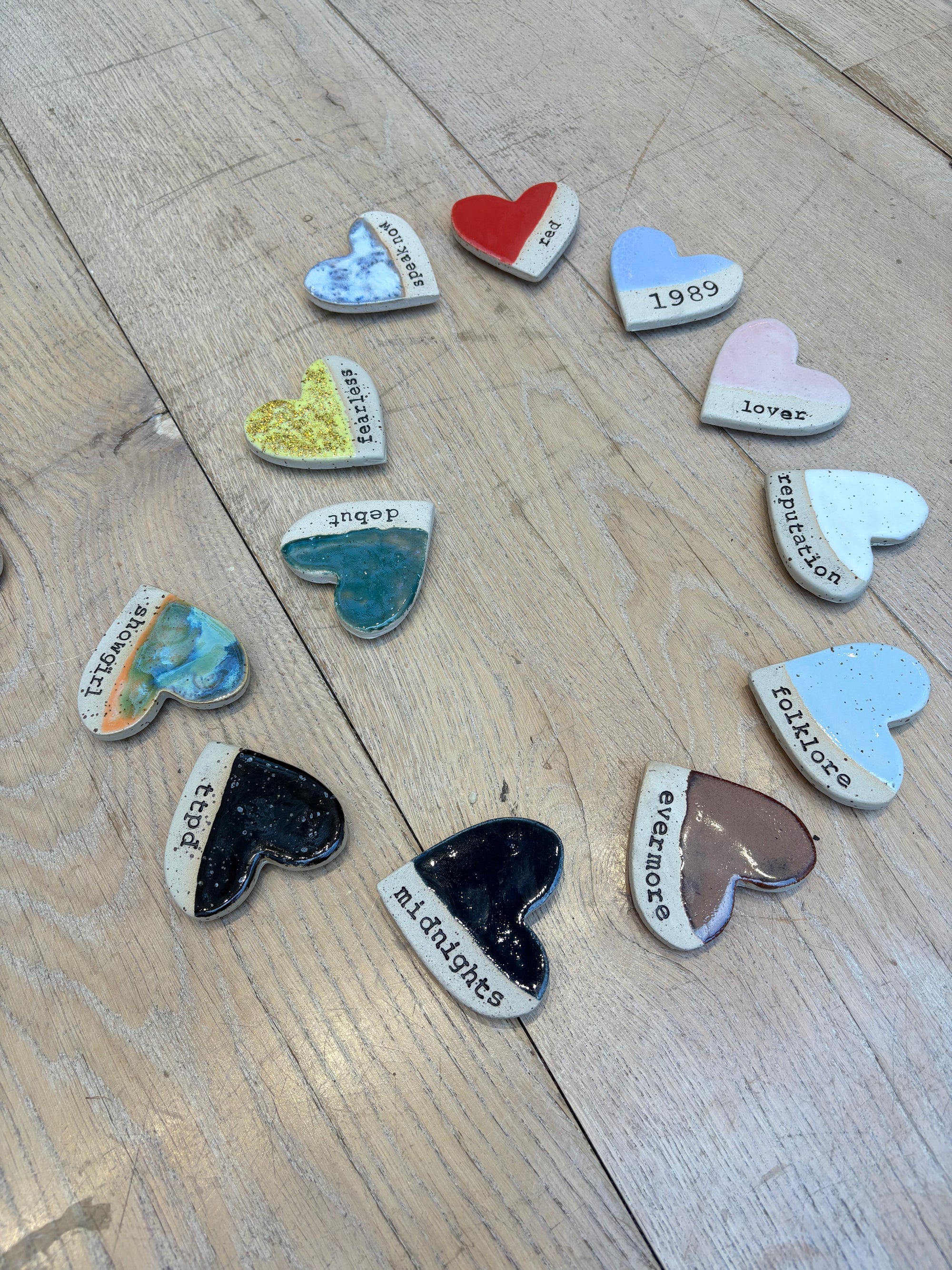 Twelve heart shaped Taylor Swift album magnets