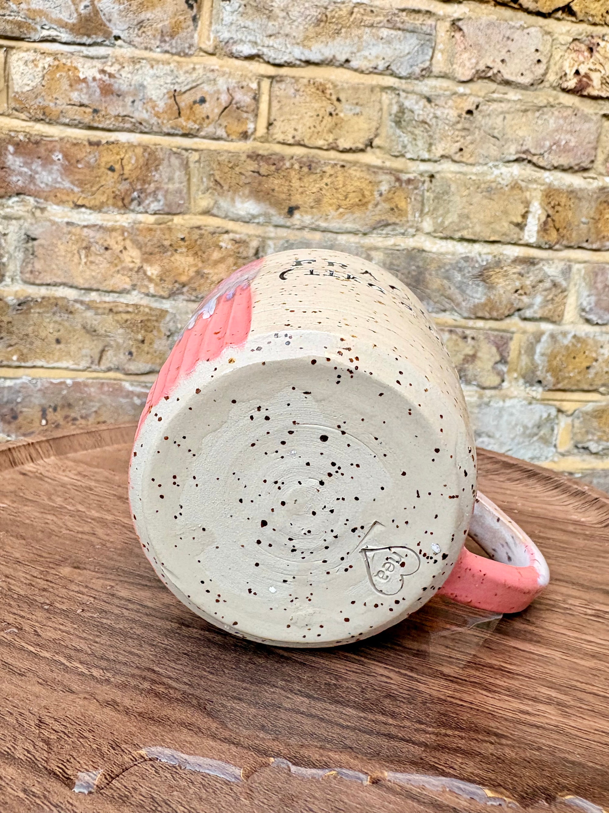 “FRAGILE (like a bomb) mug (pink, black text)