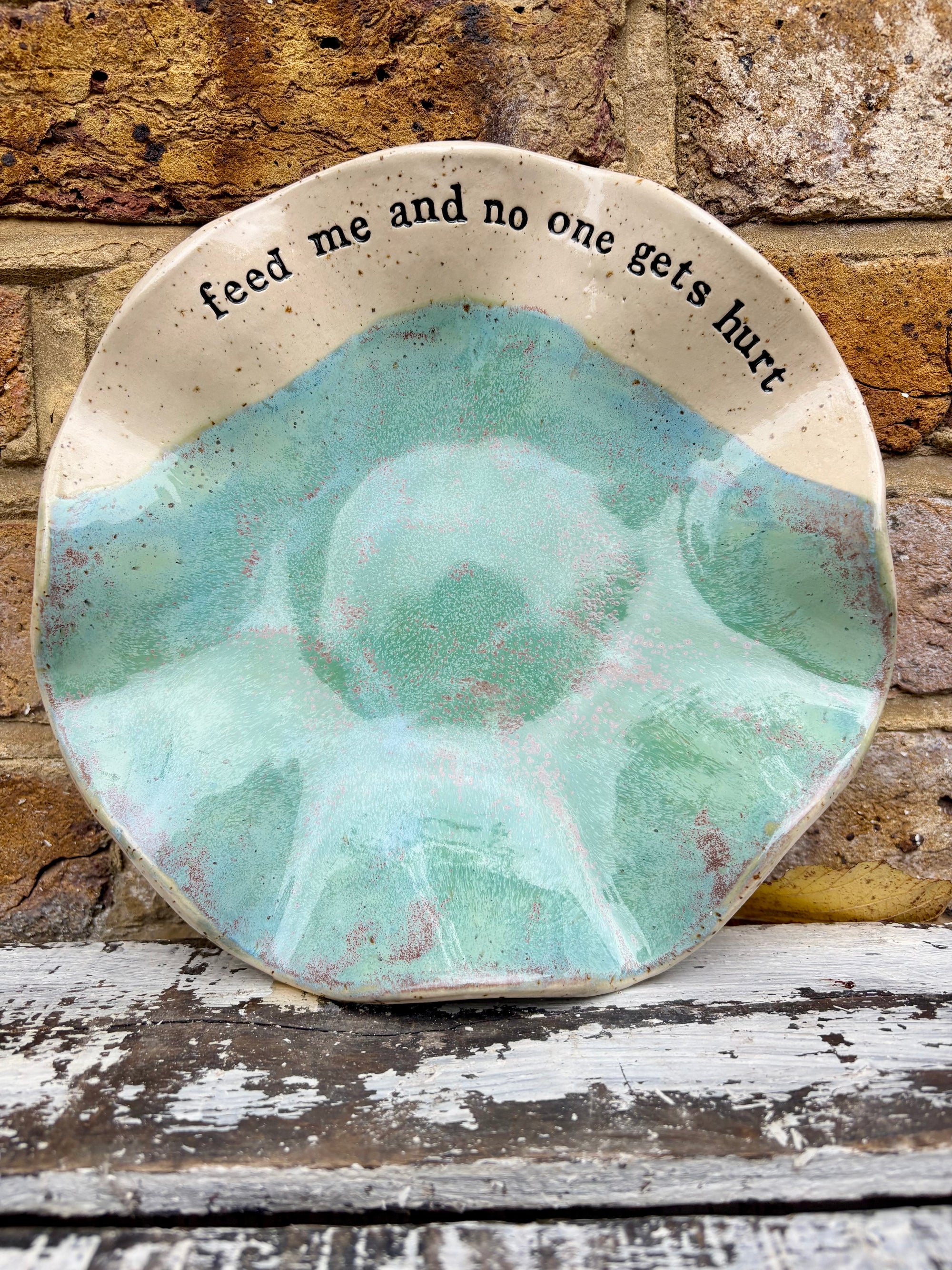 "feed me and no one gets hurt"  serving dish