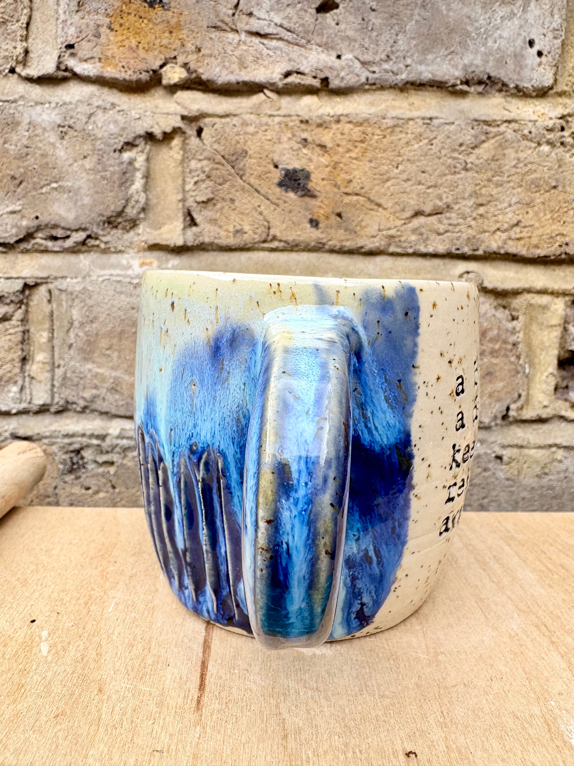 “A book a day keeps reality away" mug (blue night sky)