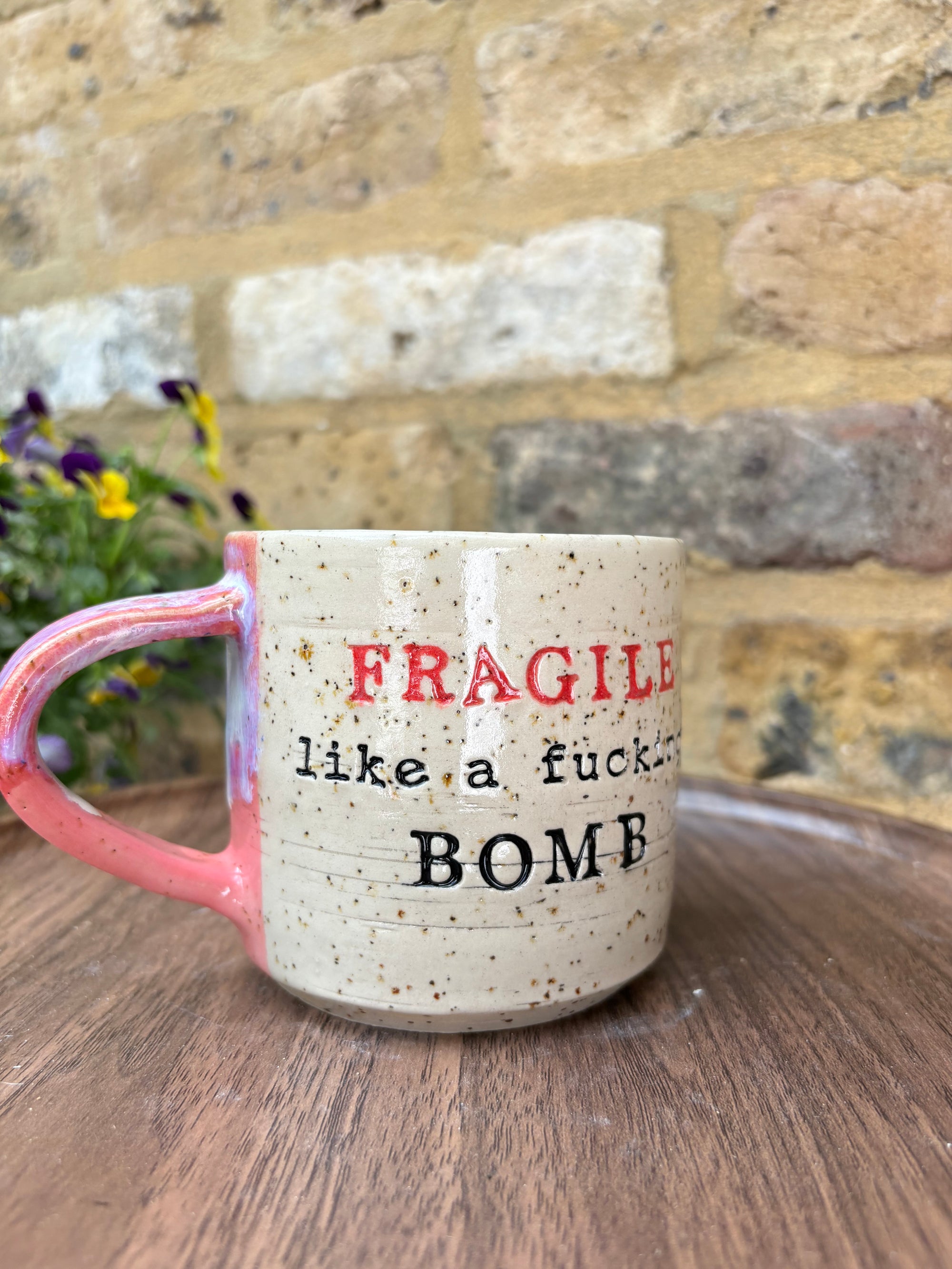 "FRAGILE like a fucking bomb" mug (pink, flecked, red FRAGILE)