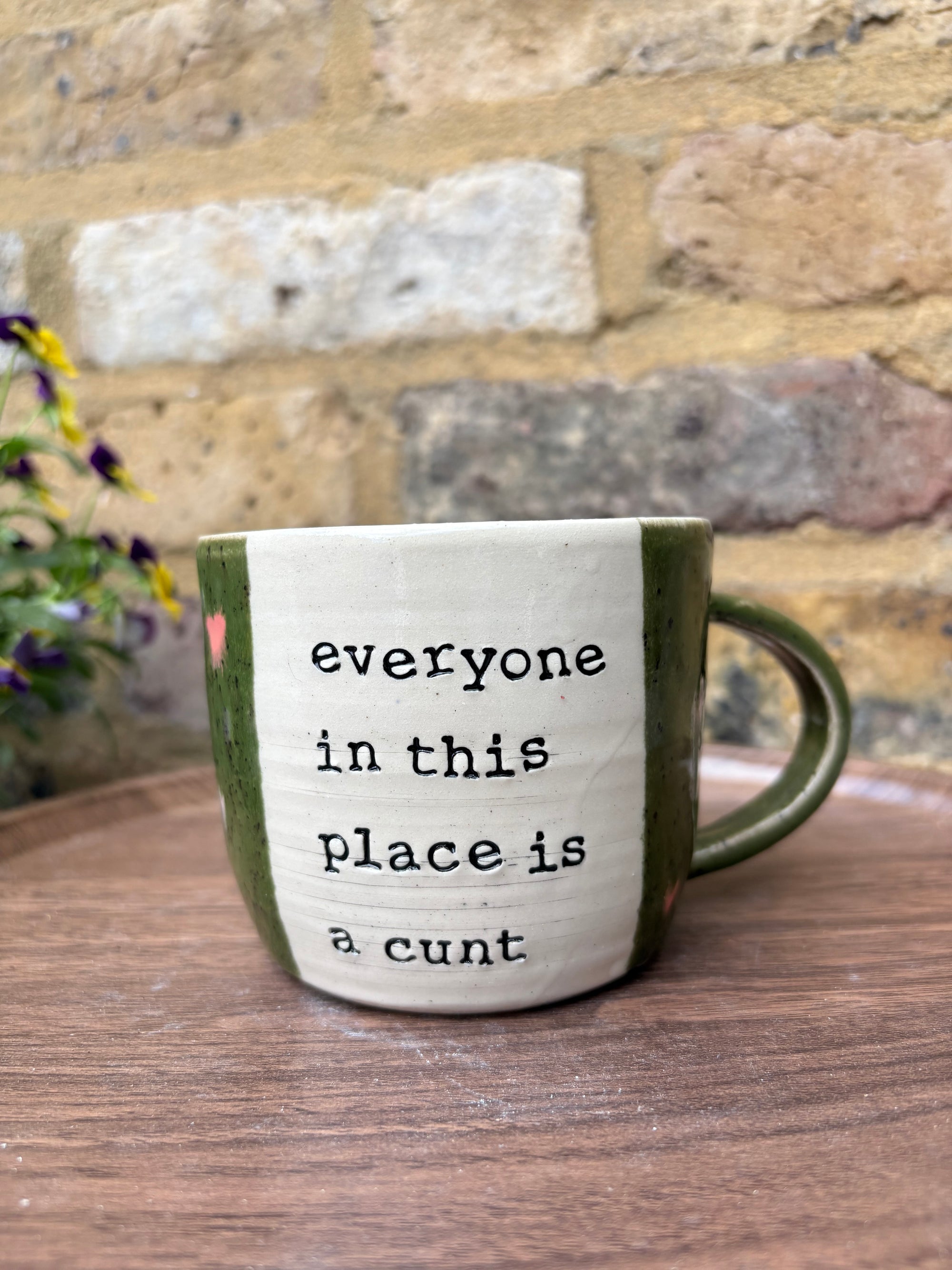 "I 🩷 WORK” "everyone in this place is a cunt" mug (green, right hander, pink hearts)