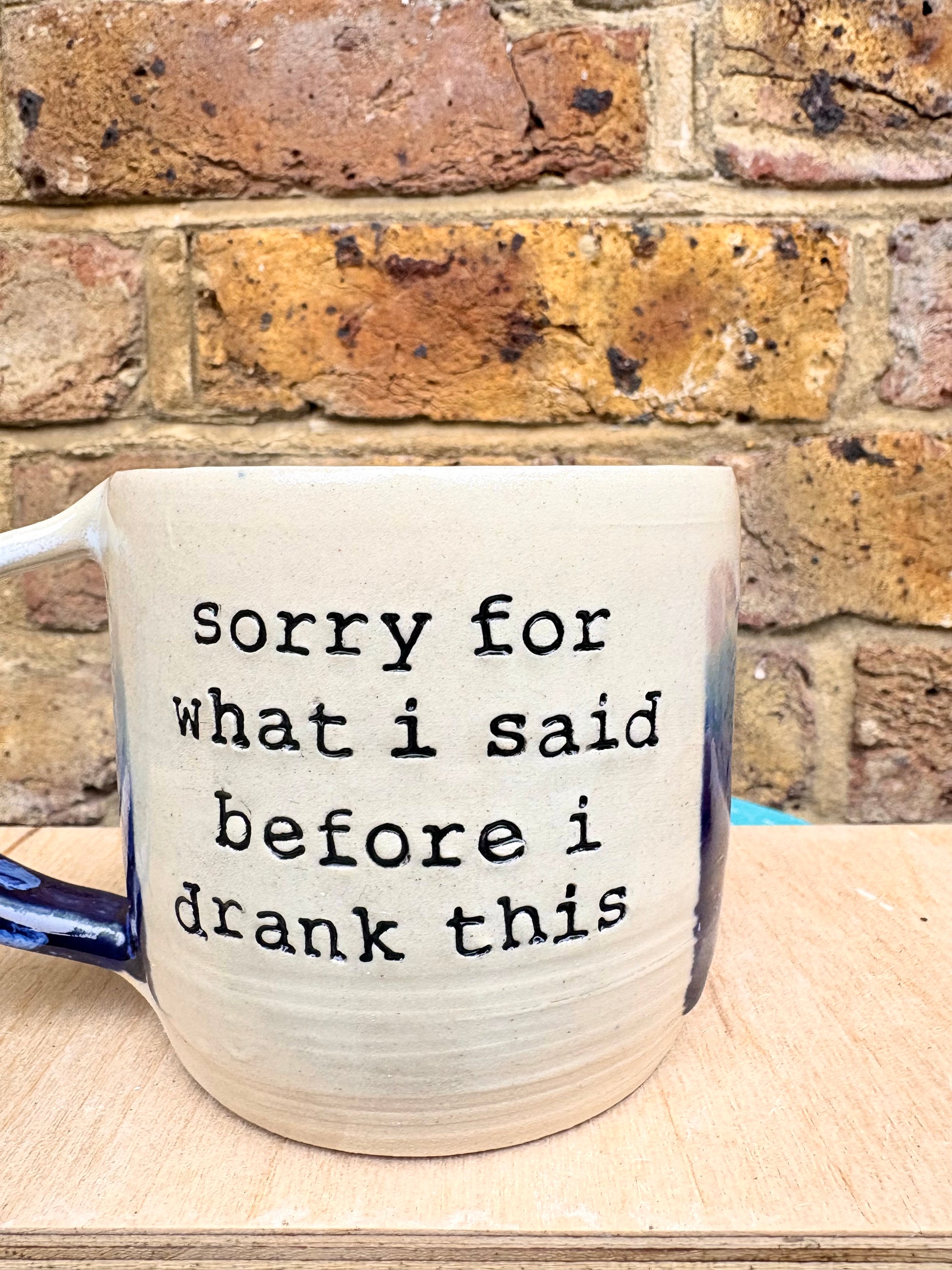 “sorry for what i said before I drank this” mug (blue night sky)