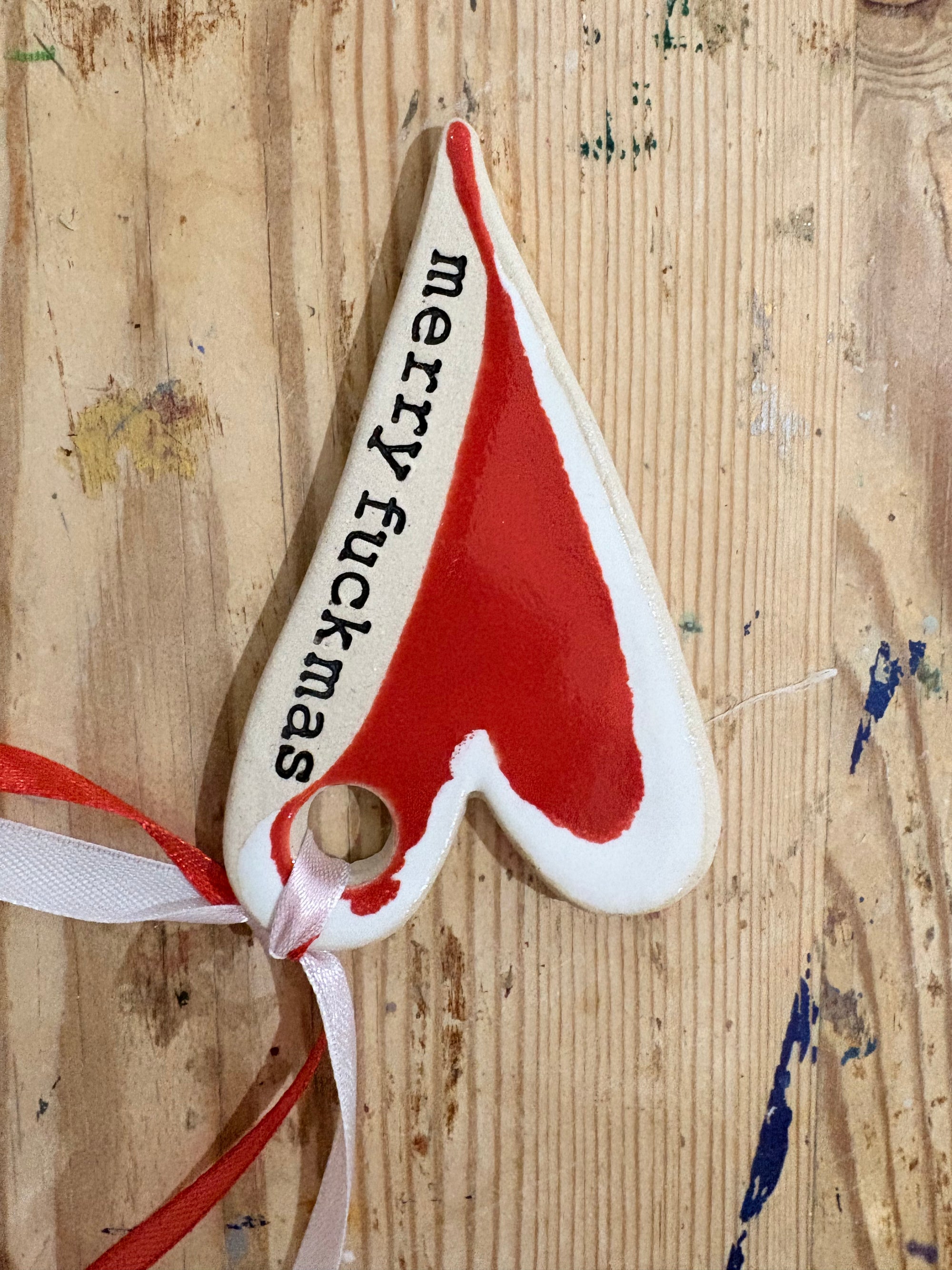 “merry fuckmas” hanging decoration (red and white, larger)