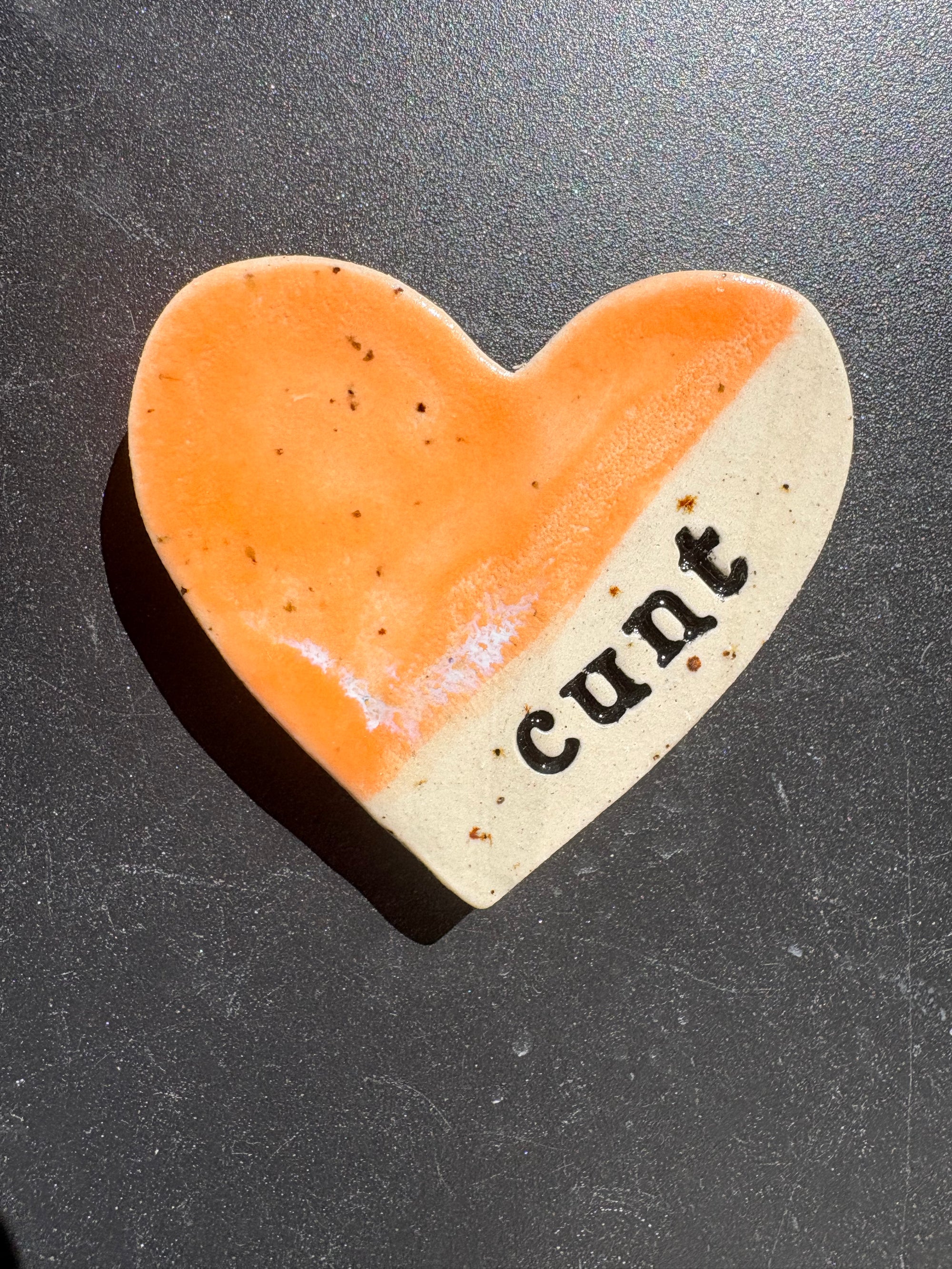 “cunt" magnet (orange, large)