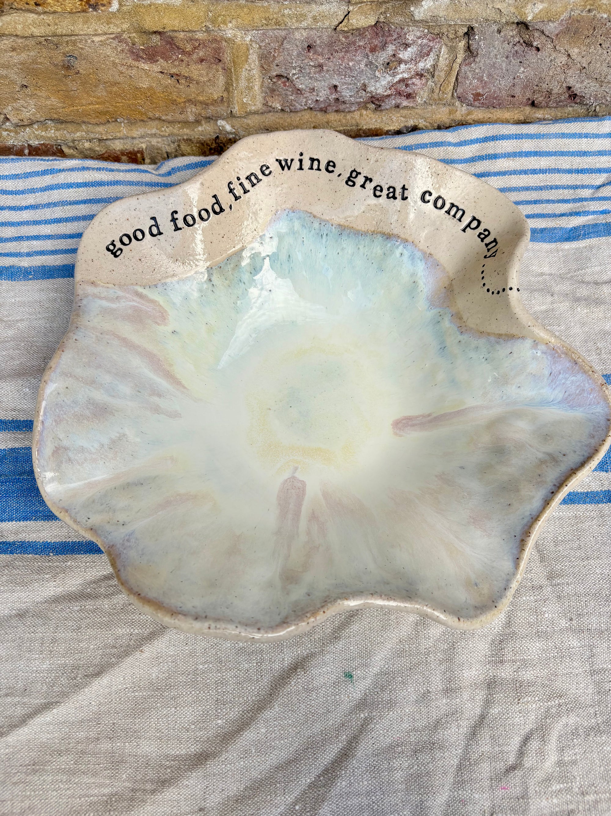 "good food, fine wine, great company..." serving dish