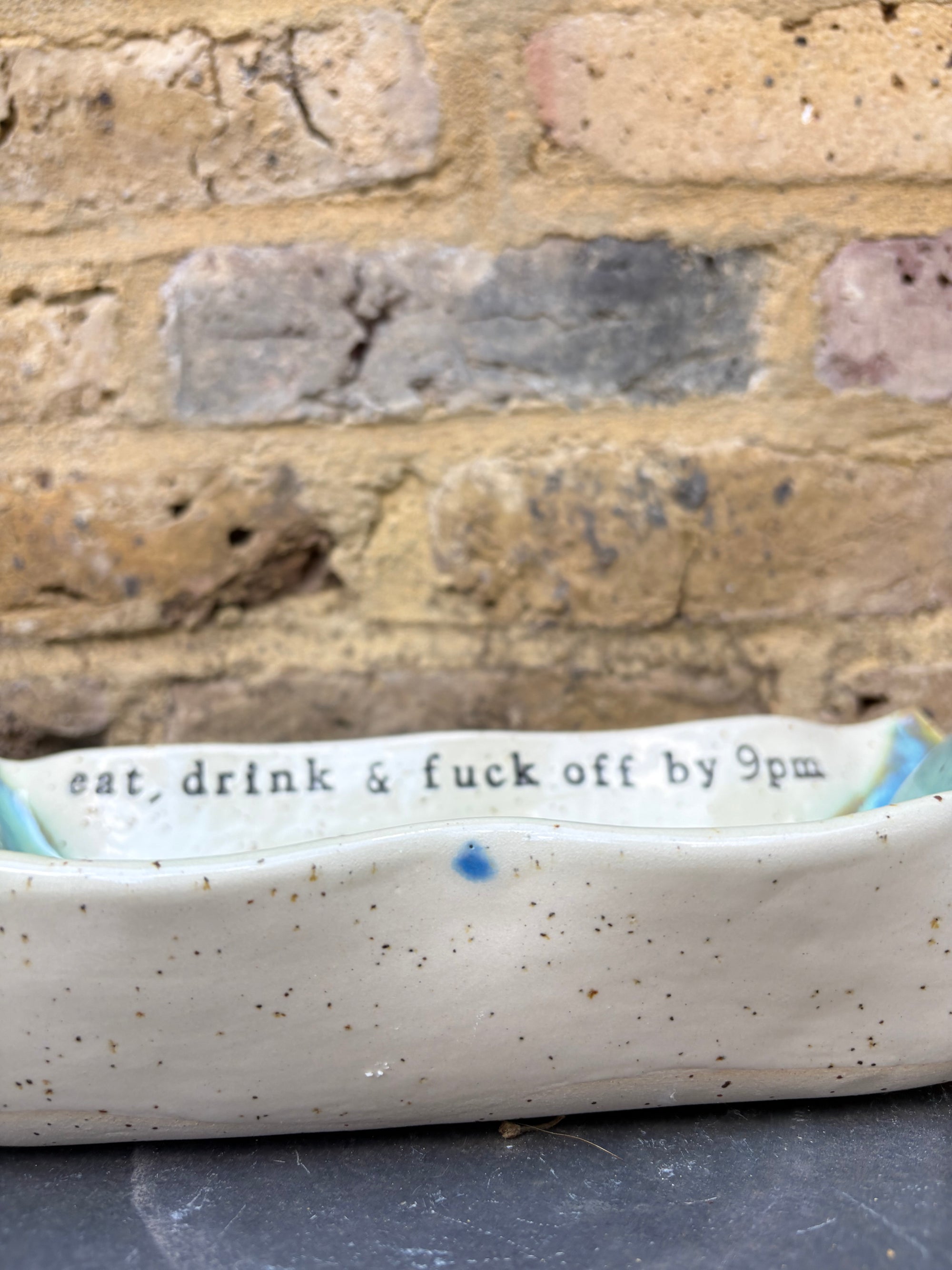 “eat, drink and fuck off by 9pm" rectangular dish (green, flecked clay)