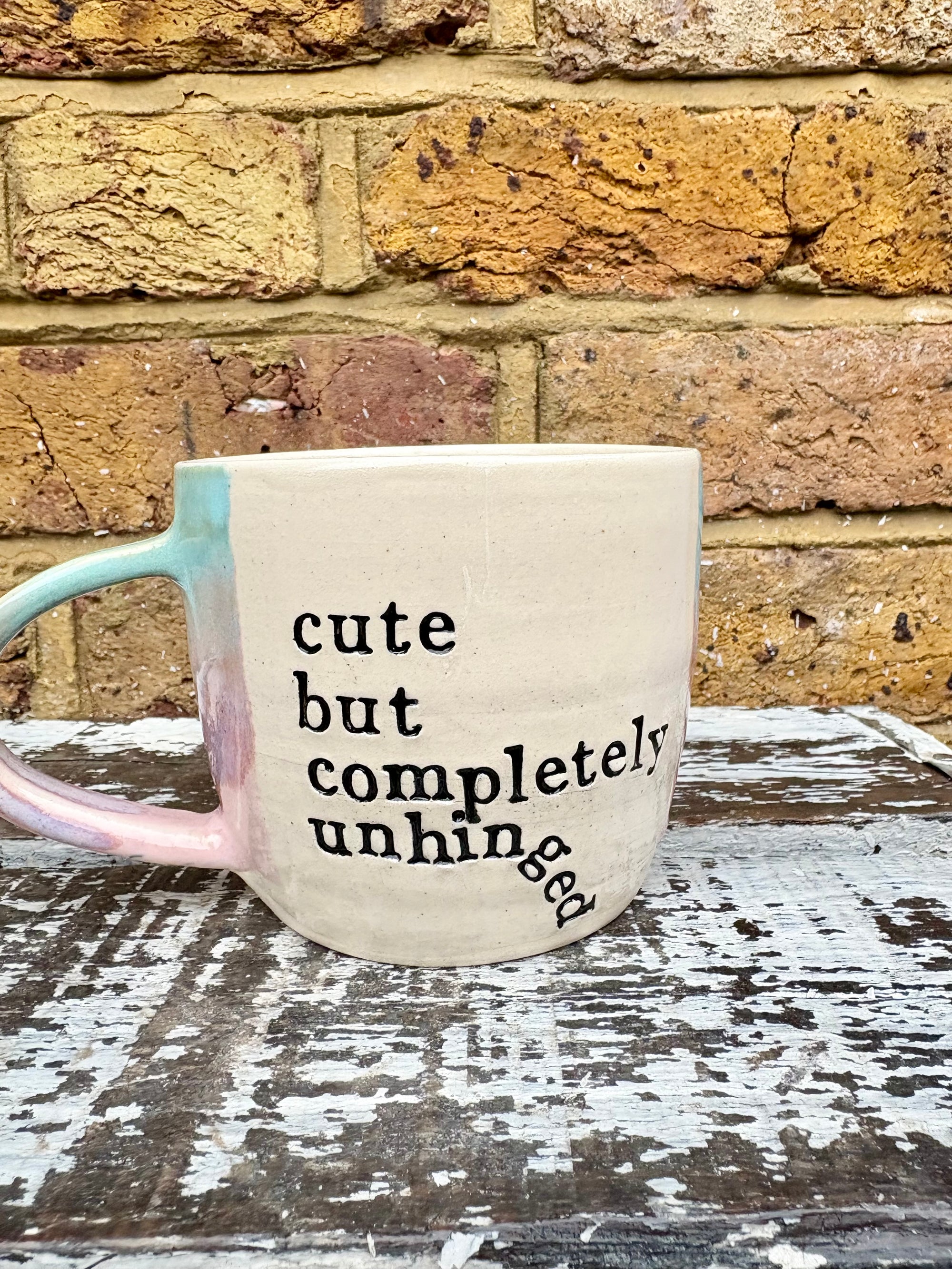 "cute but completely unhinged" mug