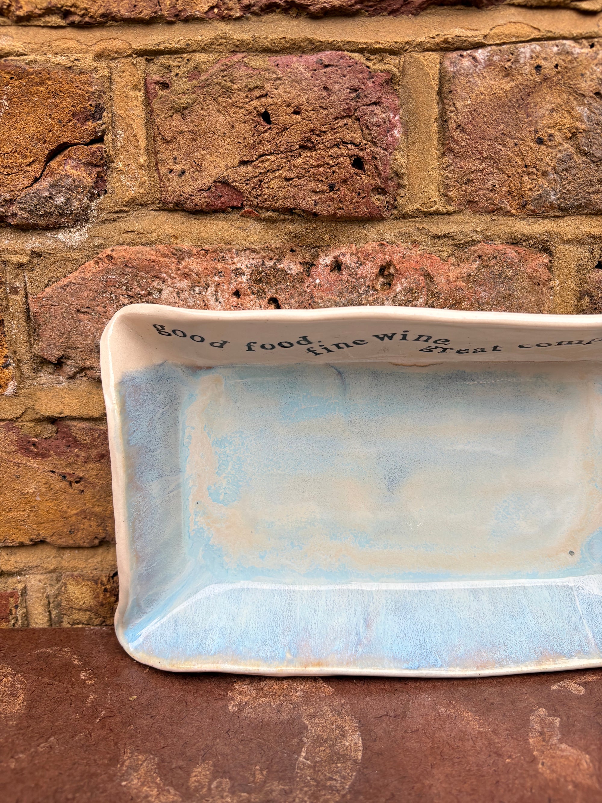 “good food, fine wine, great company..." rectangular salad/serving dish