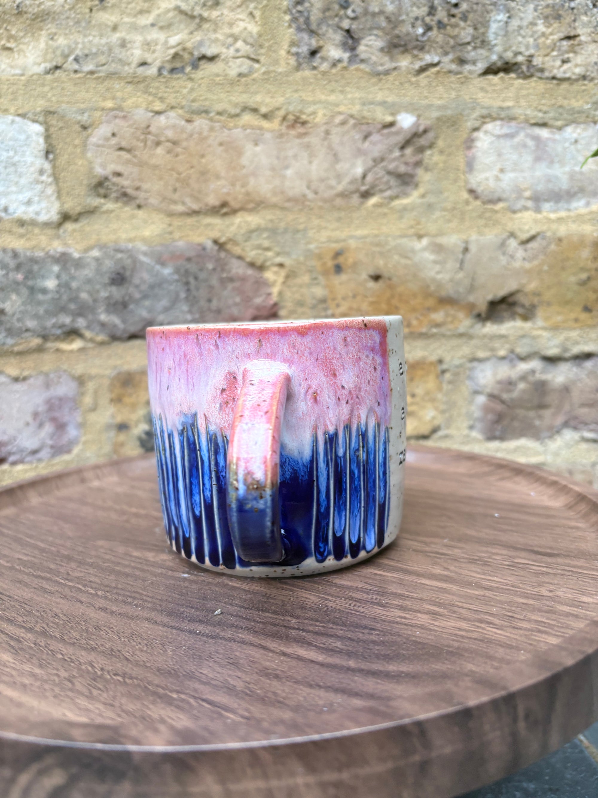 Large “A book a day keeps reality away" mug (pink sky)