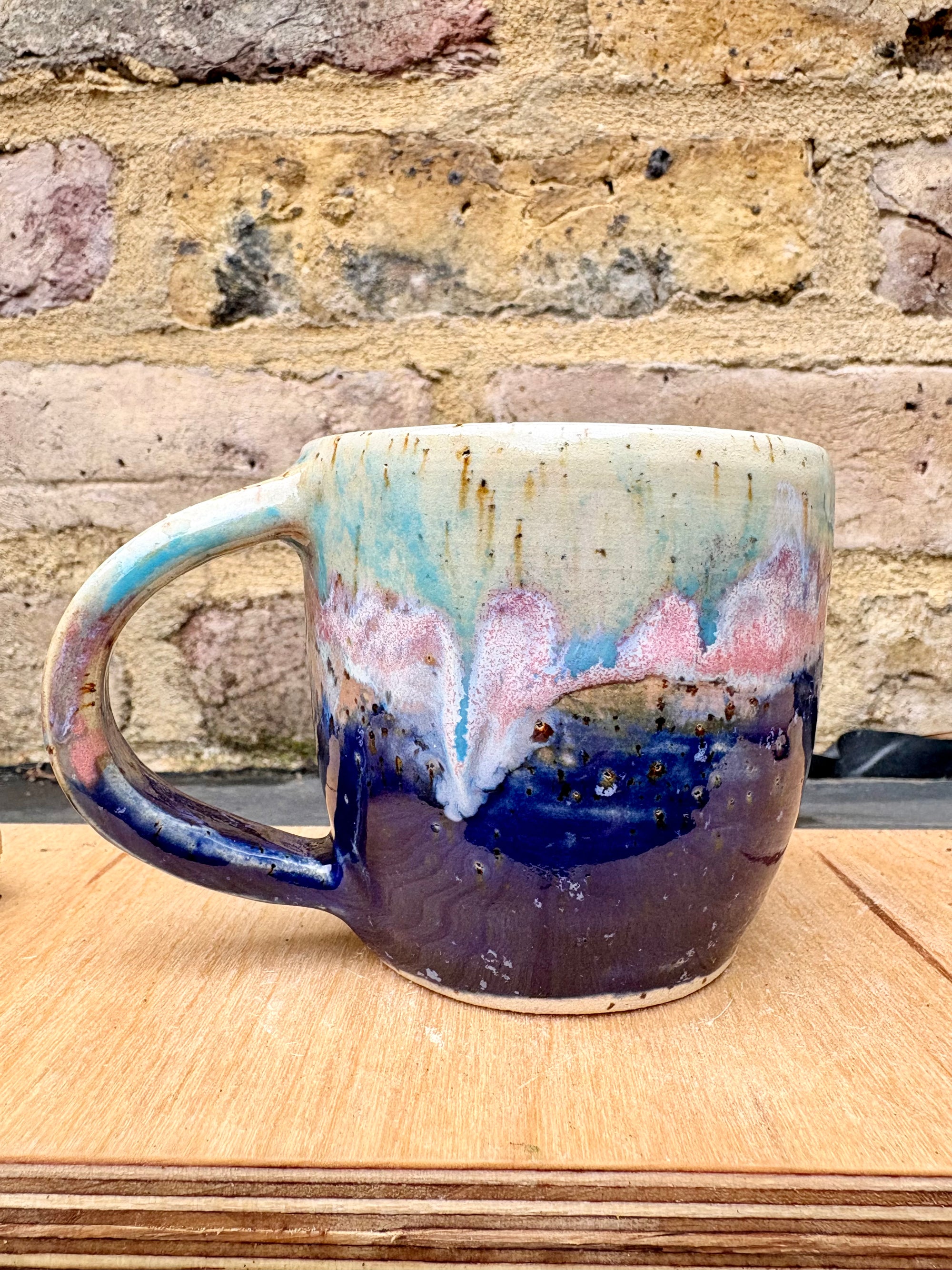 “A book a day keeps reality away" mug (blue night sky)