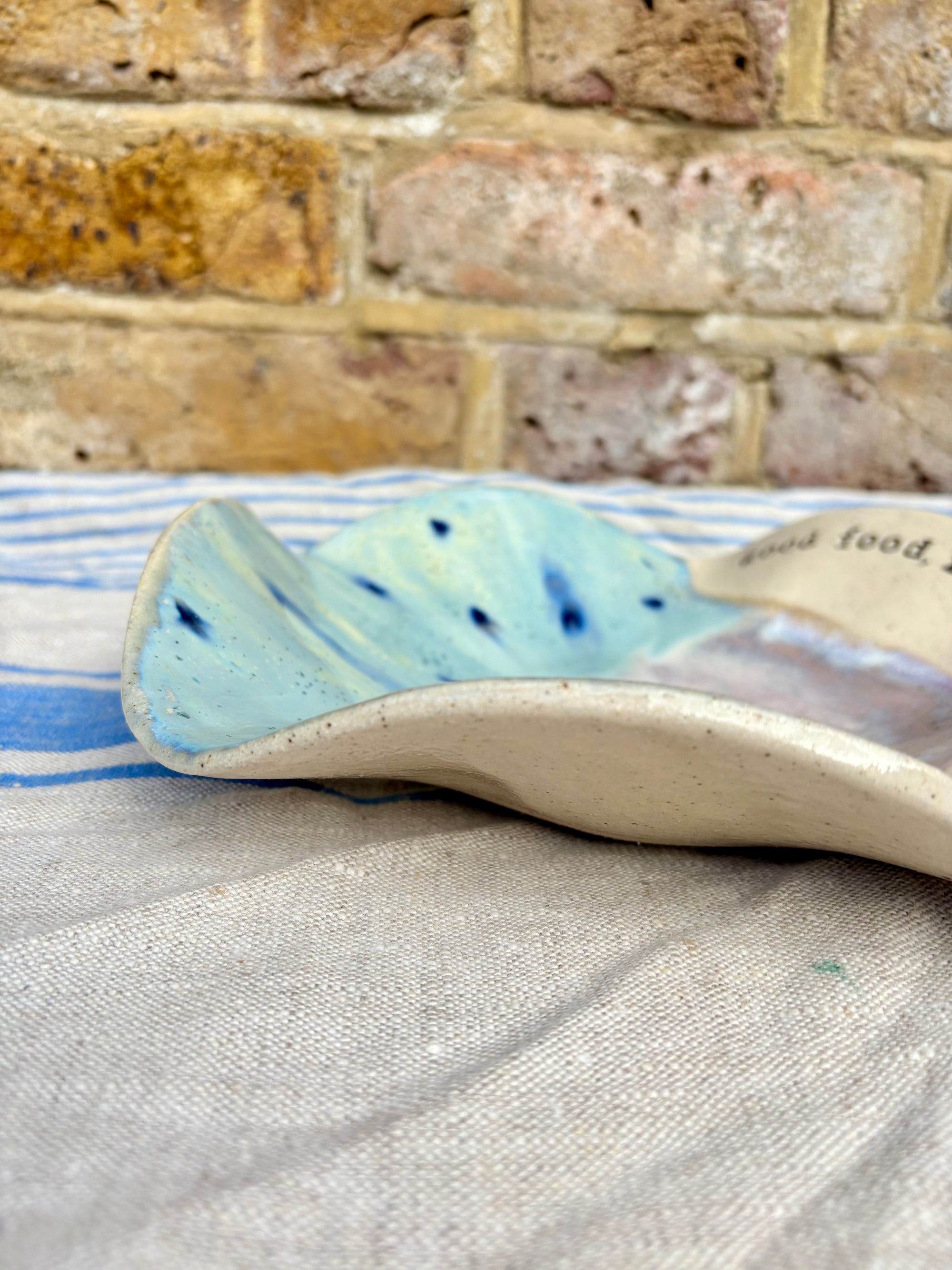 "good food, fine wine, great company..." serving dish