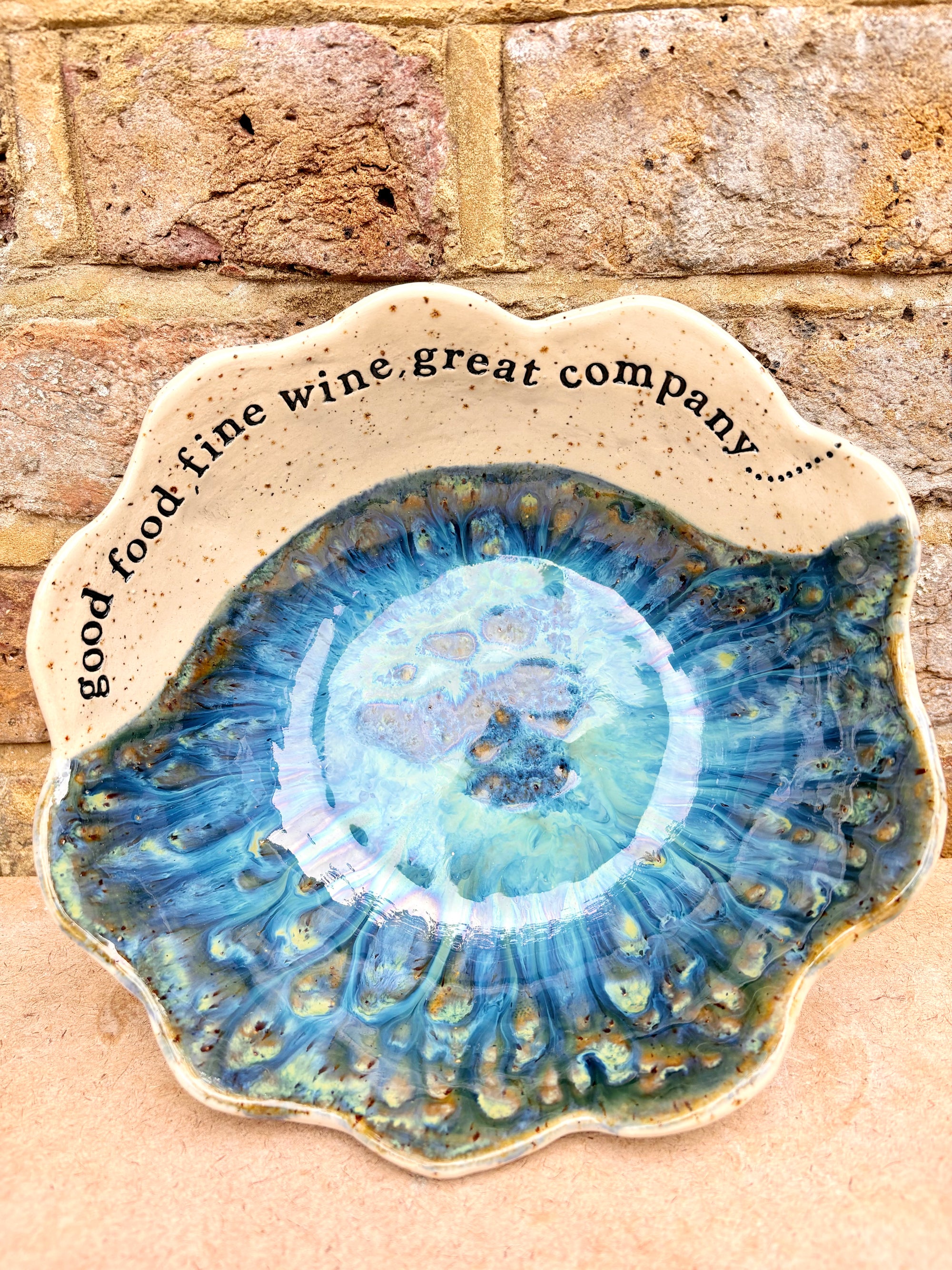 "good food, fine wine, great company..." deep salad/serving dish