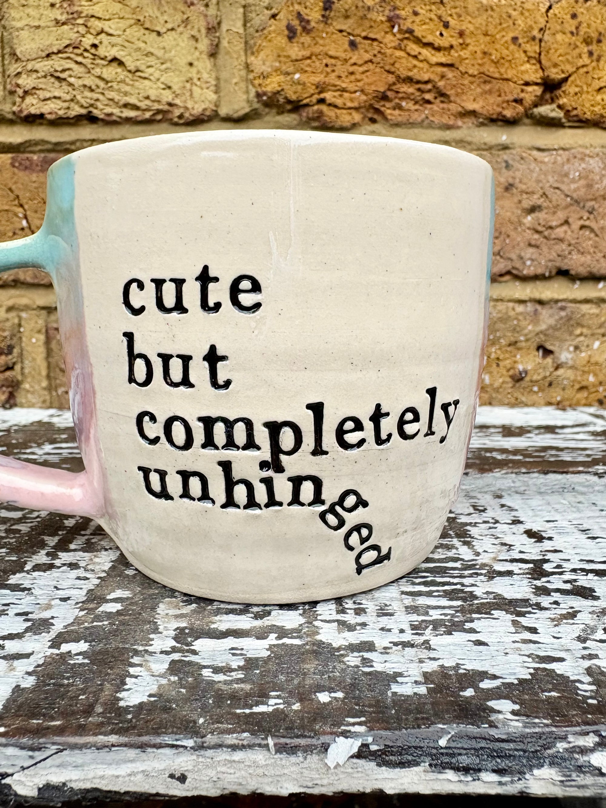 "cute but completely unhinged" mug