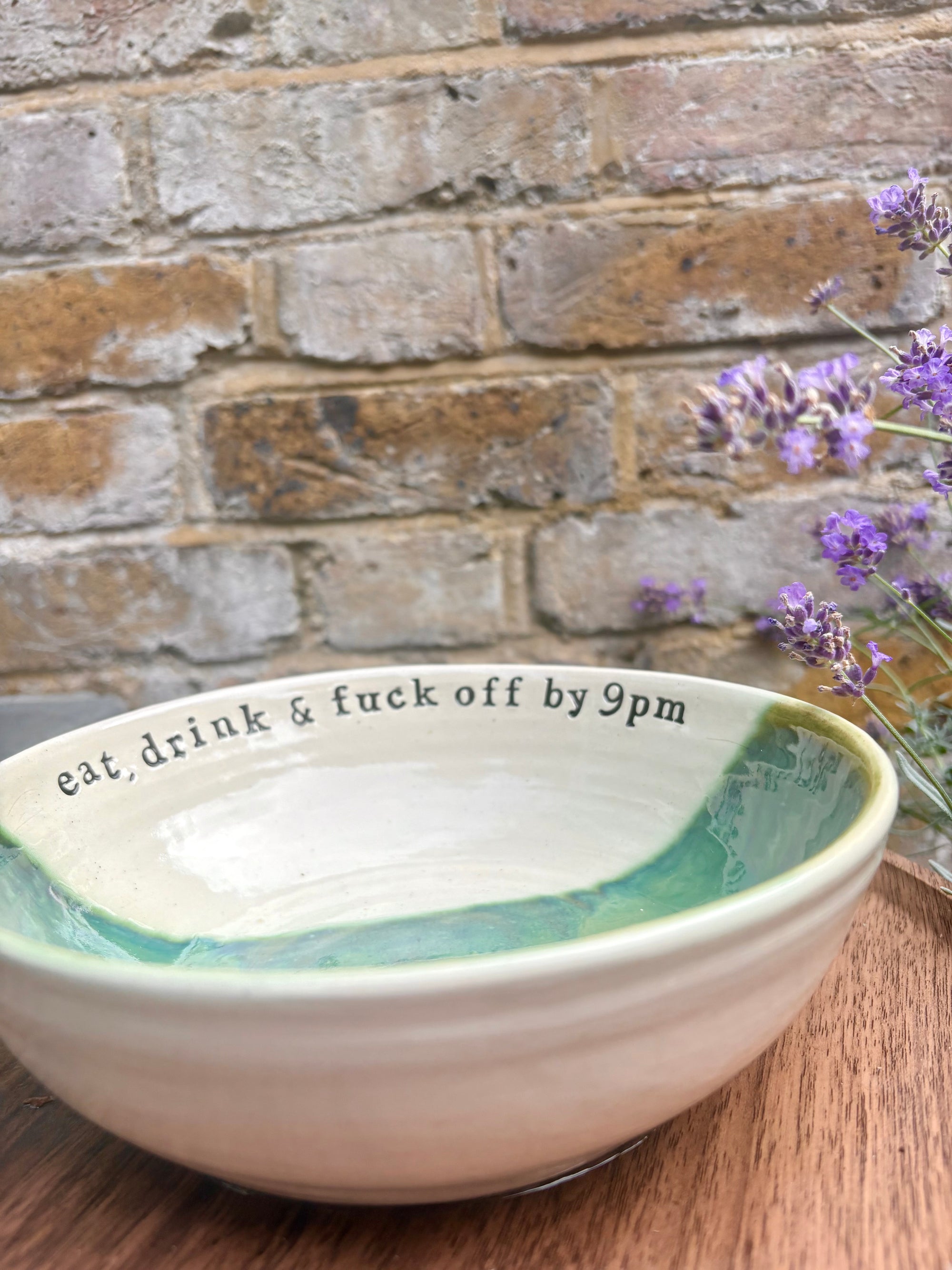 “eat, drink and fuck off by 9pm" round (ish) pasta/salad/serving bowl (green, cream clay)