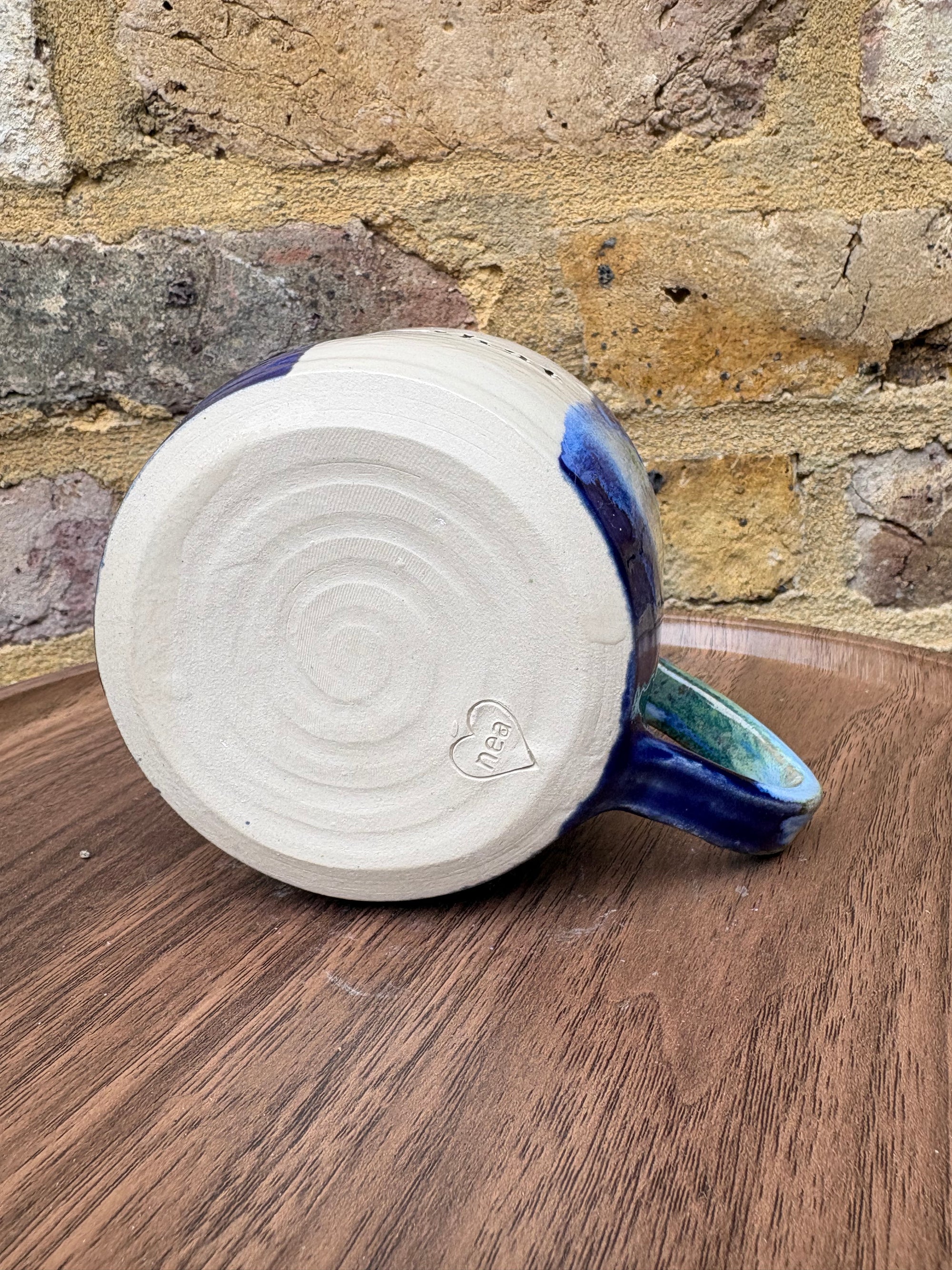“What” “the fuck” mug (cream, blue/green)