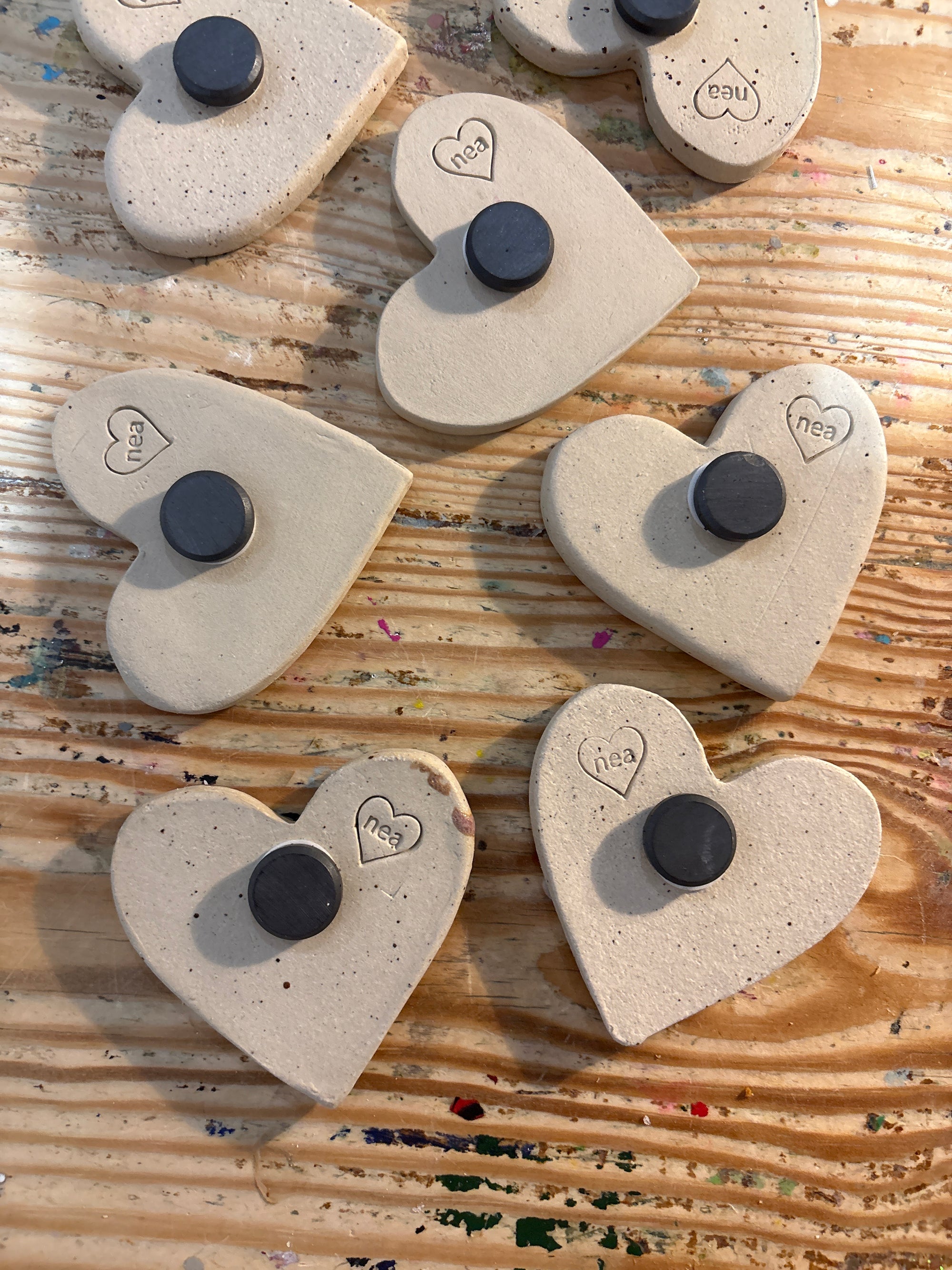 Twelve heart shaped Taylor Swift album magnets