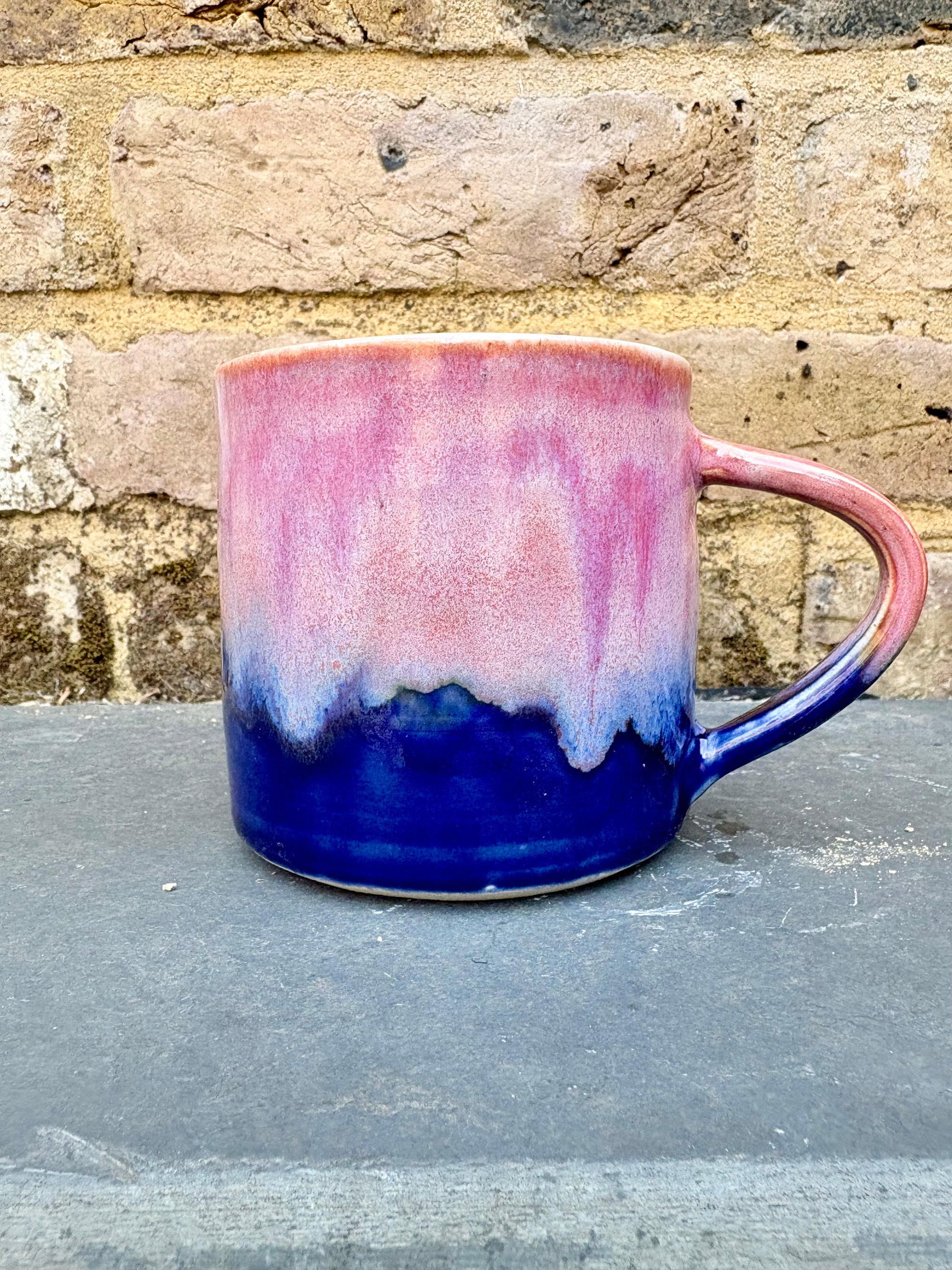 "really happy to be here” "what a bunch of cunts" mug (pink/blue)