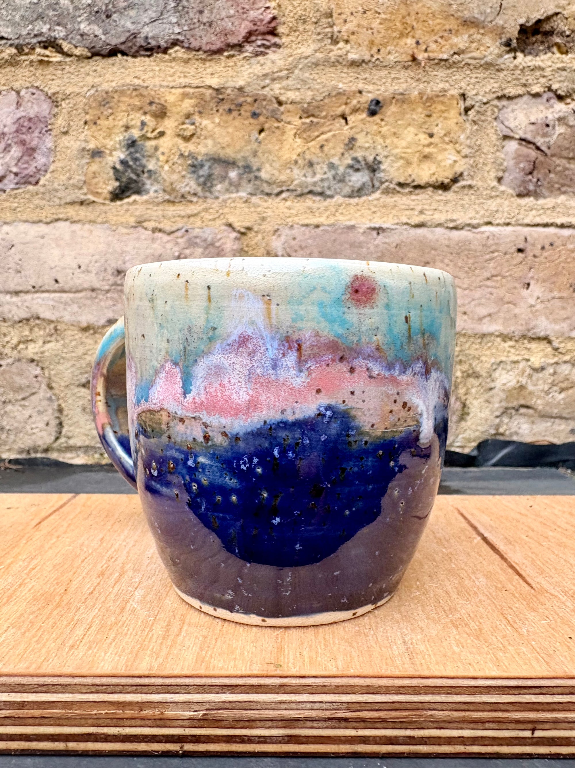 “A book a day keeps reality away" mug (blue night sky)