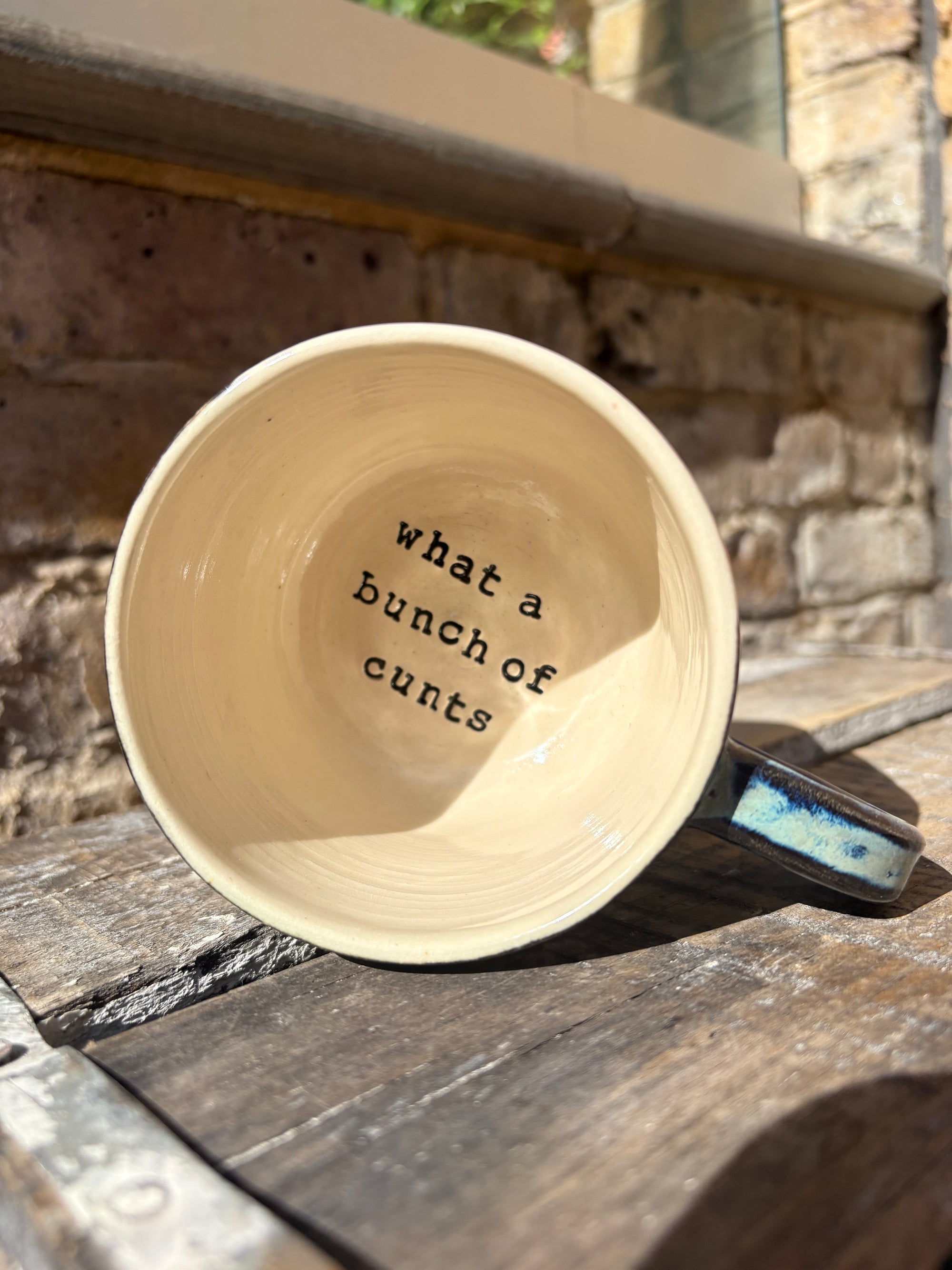"really happy to be here” "what a bunch of cunts" mug (medium, blue shore)
