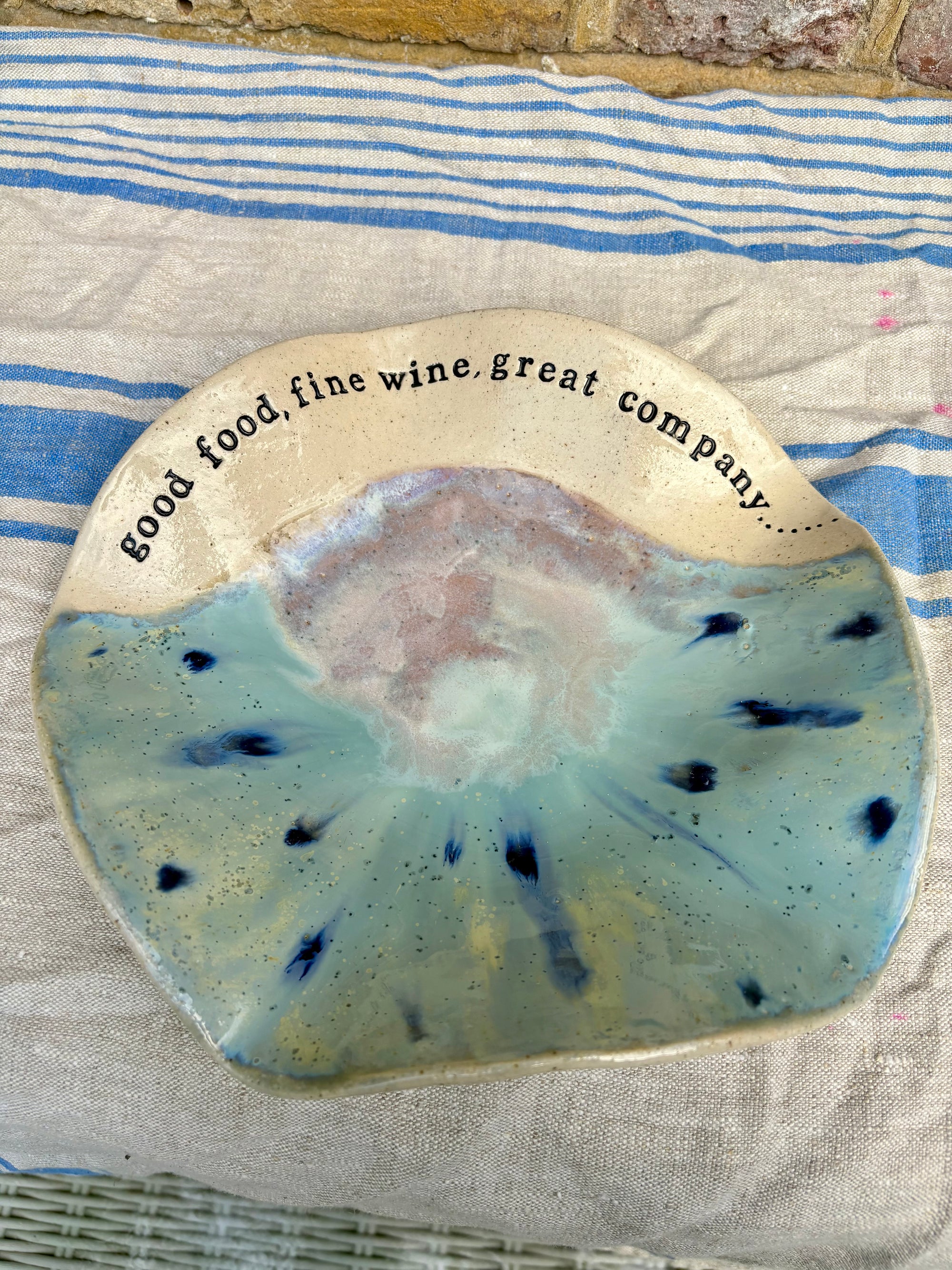 "good food, fine wine, great company..." serving dish