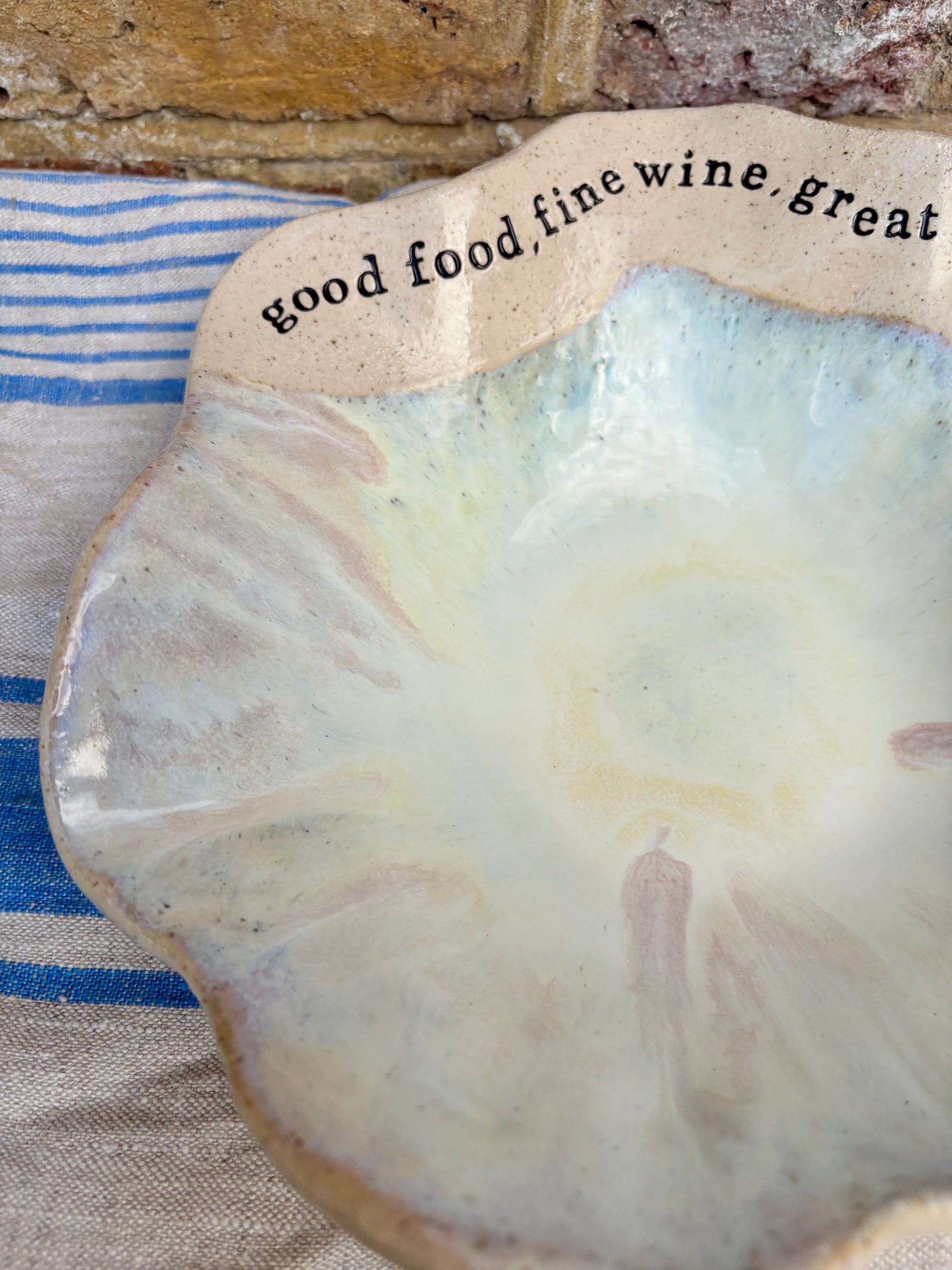 "good food, fine wine, great company..." serving dish