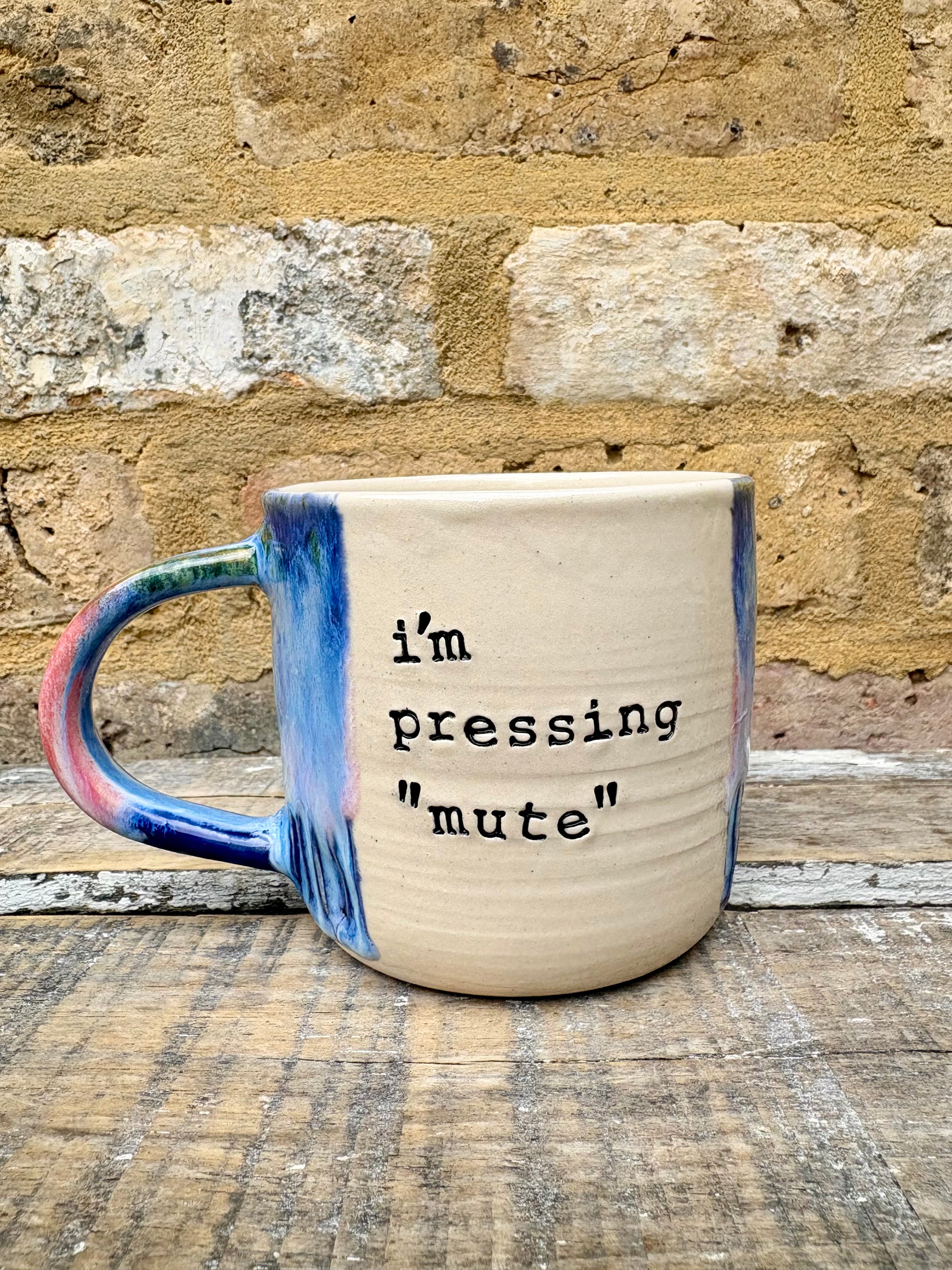 '"i'm pressing "mute"' mug