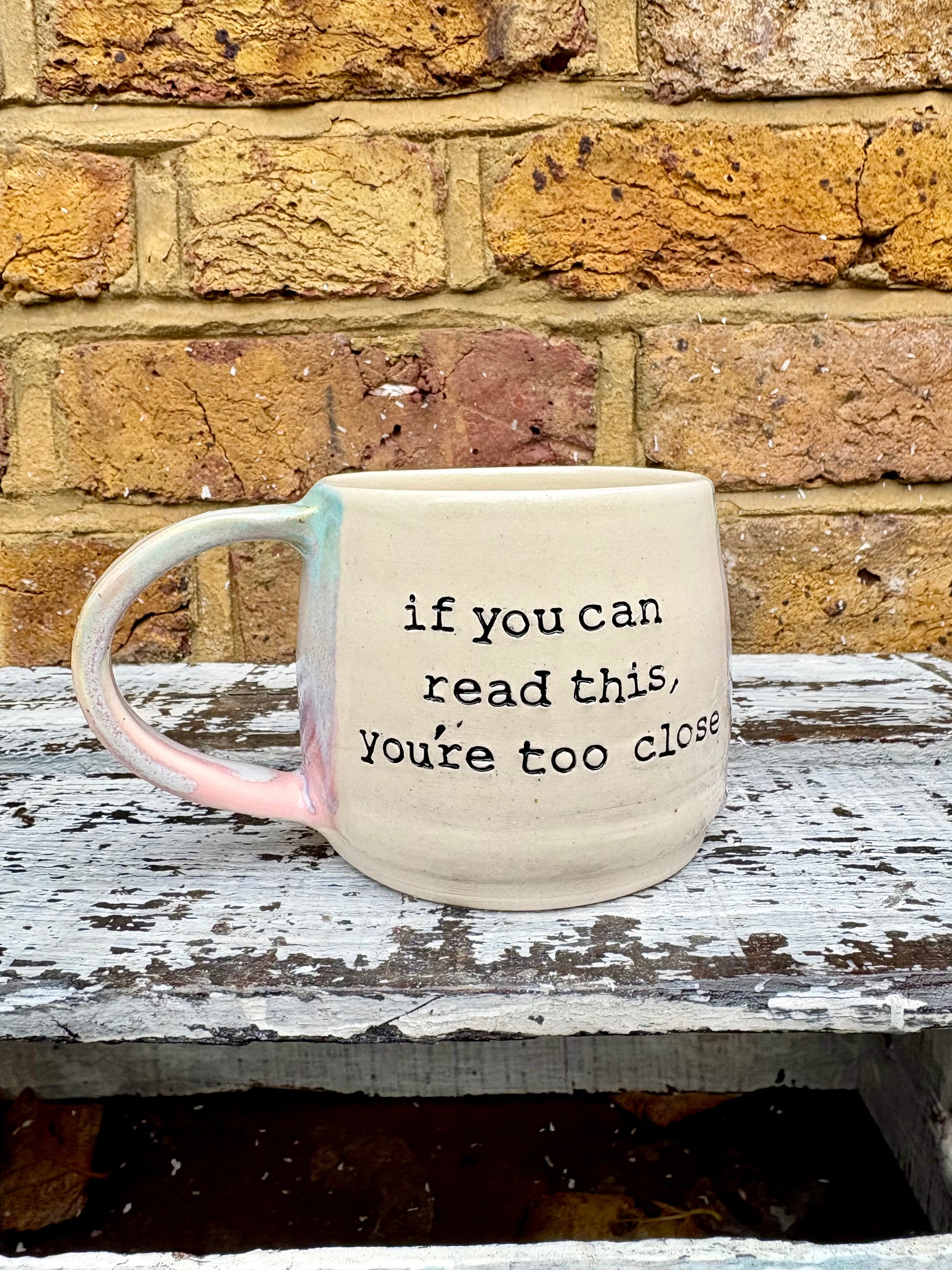 "if you can read this, you're too close" mug (Pink Skies)