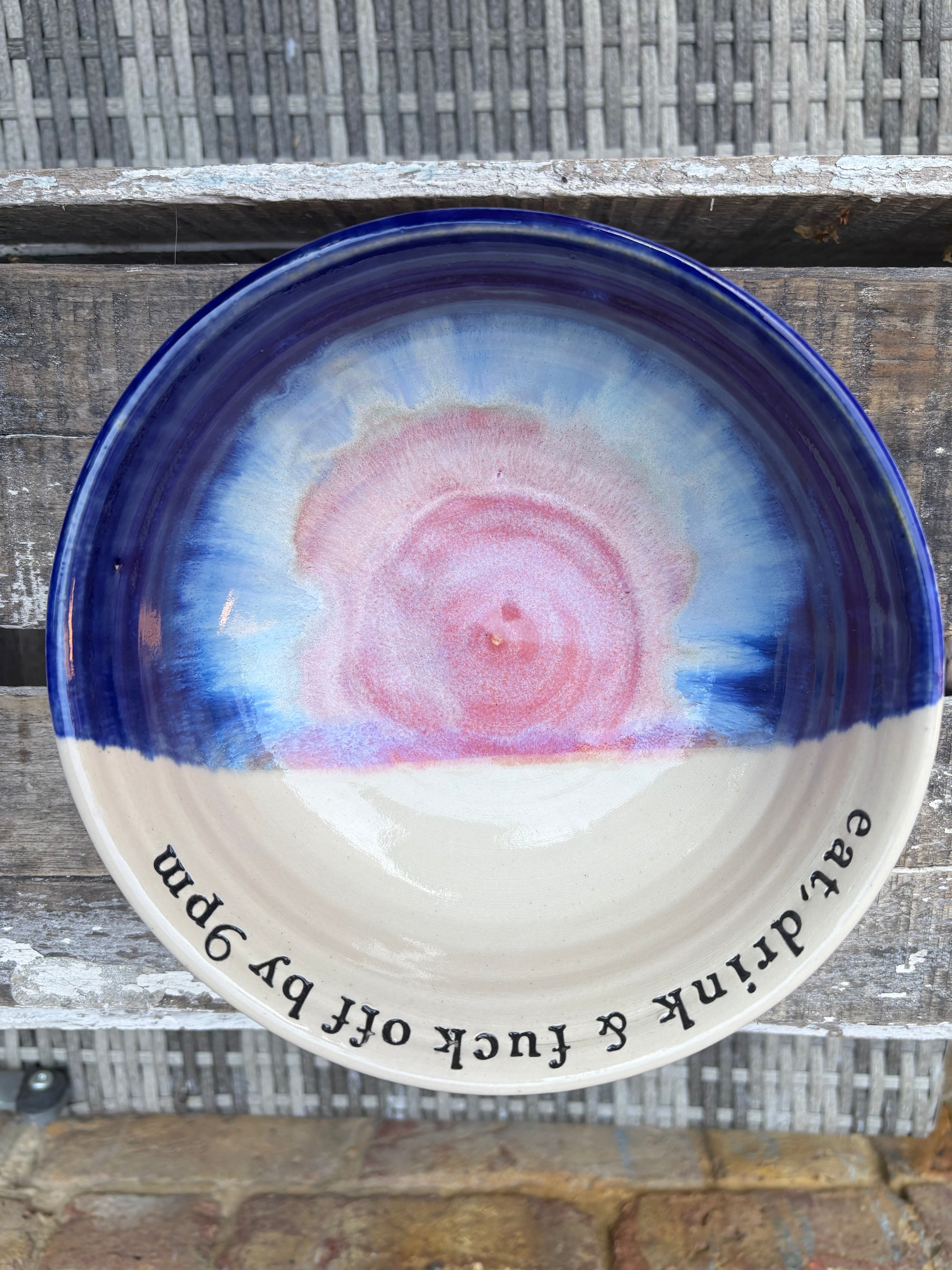 “eat, drink and fuck off by 9pm"  deep round salad/pasta bowl (pink night sky)