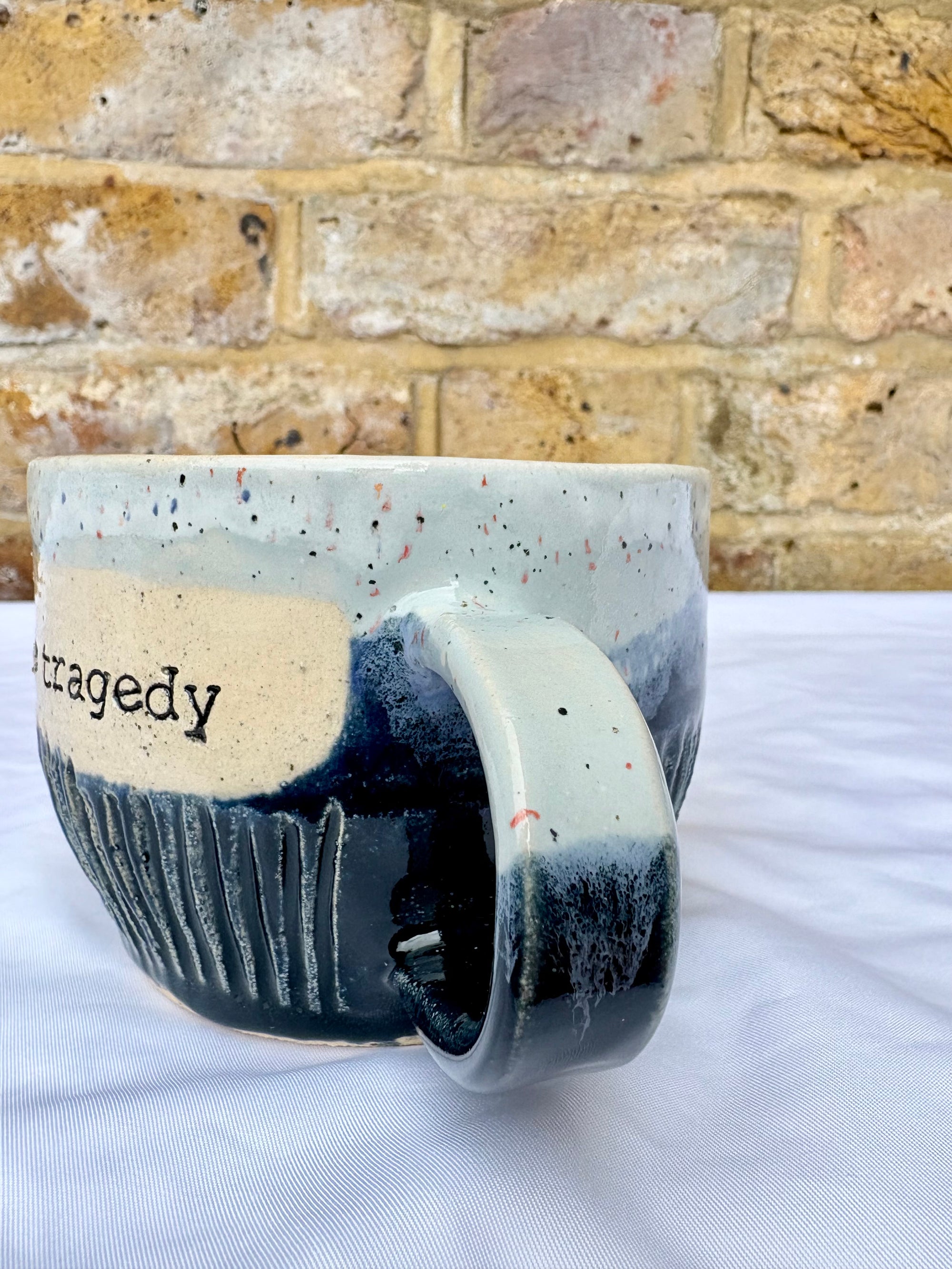 "oh the tragedy" mug