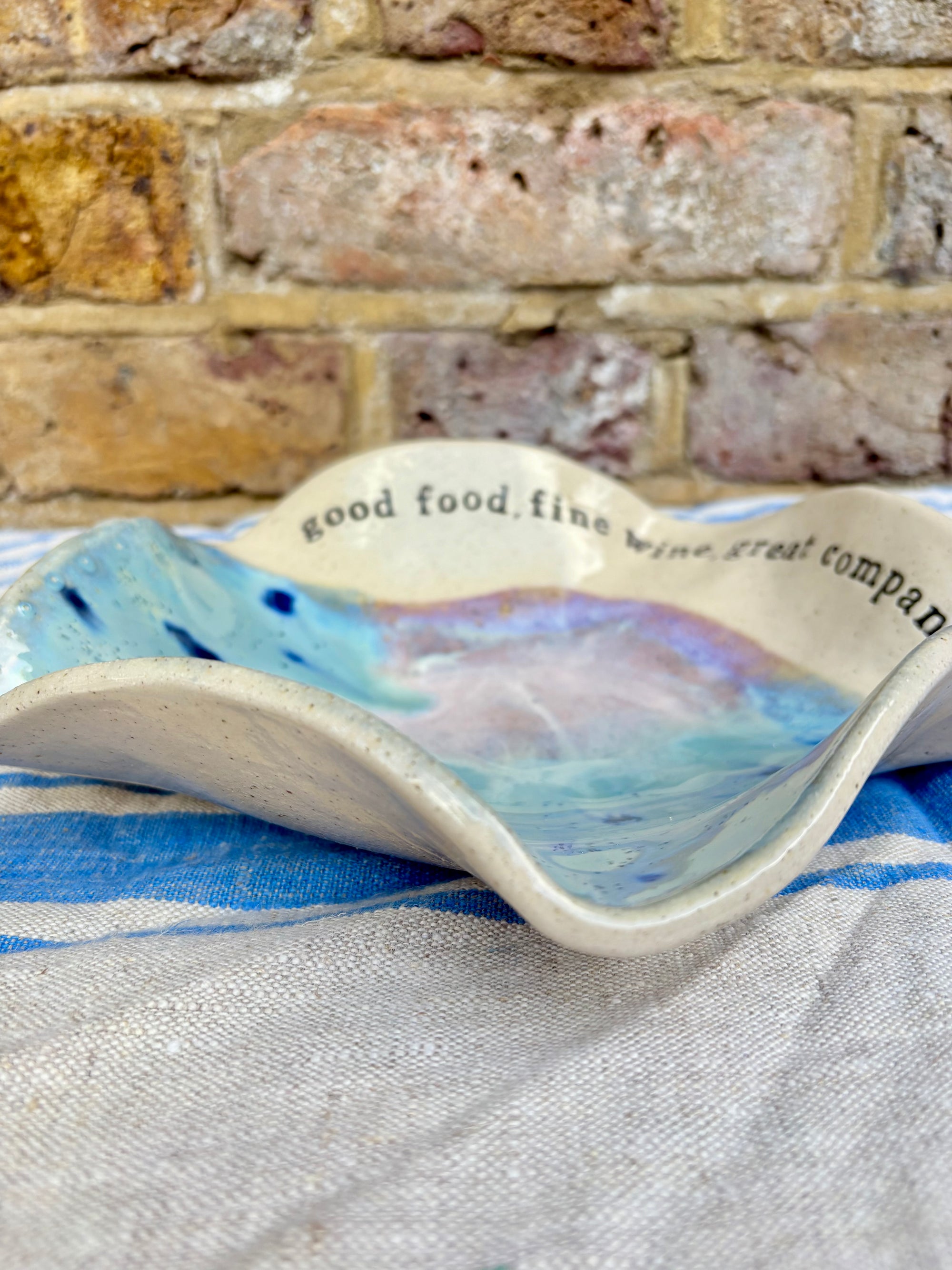 "good food, fine wine, great company..." serving dish