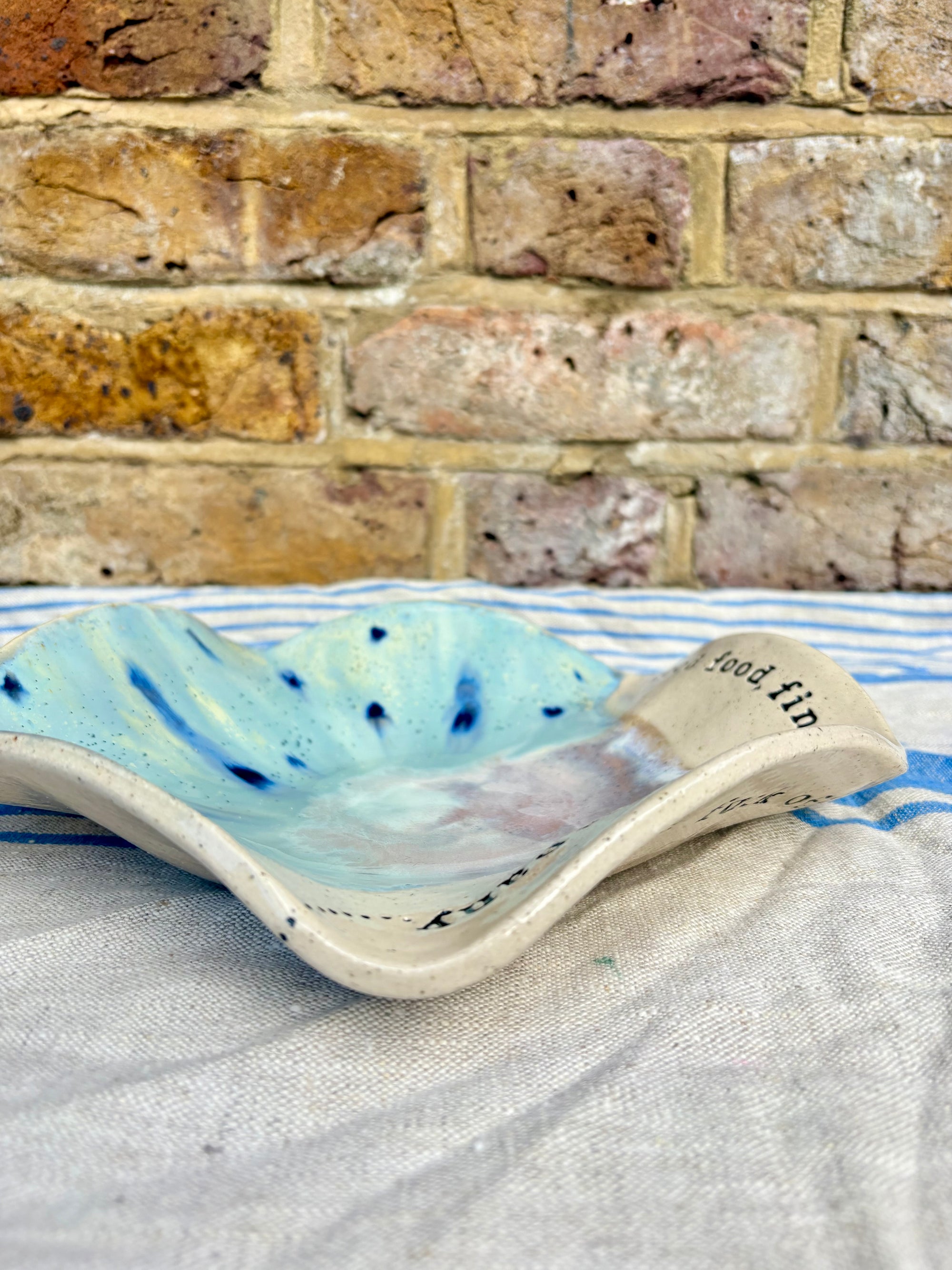 "good food, fine wine, great company..." serving dish