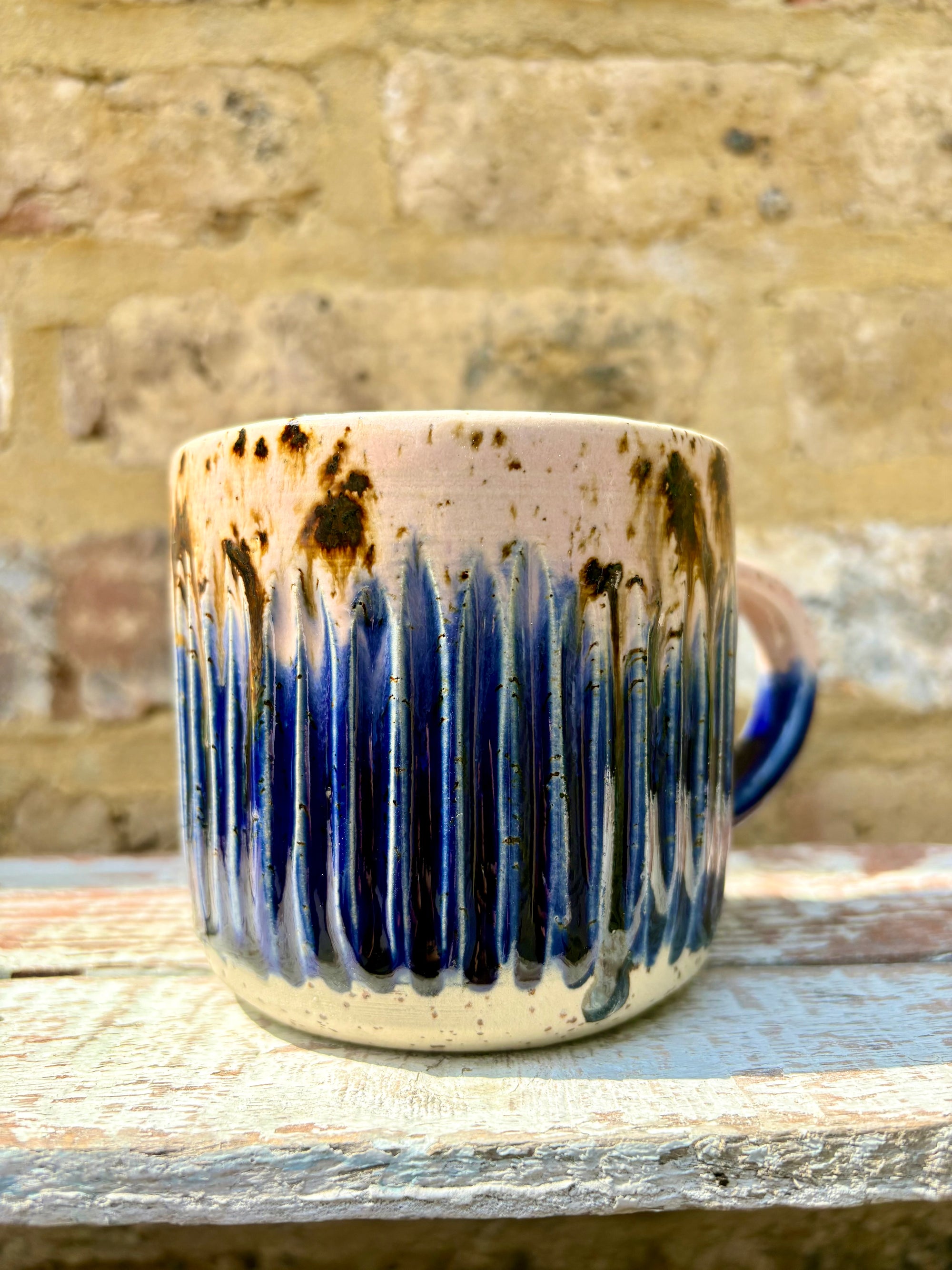 "happy to be here” "what a bunch of cunts" mug (pink/blue, grooves)