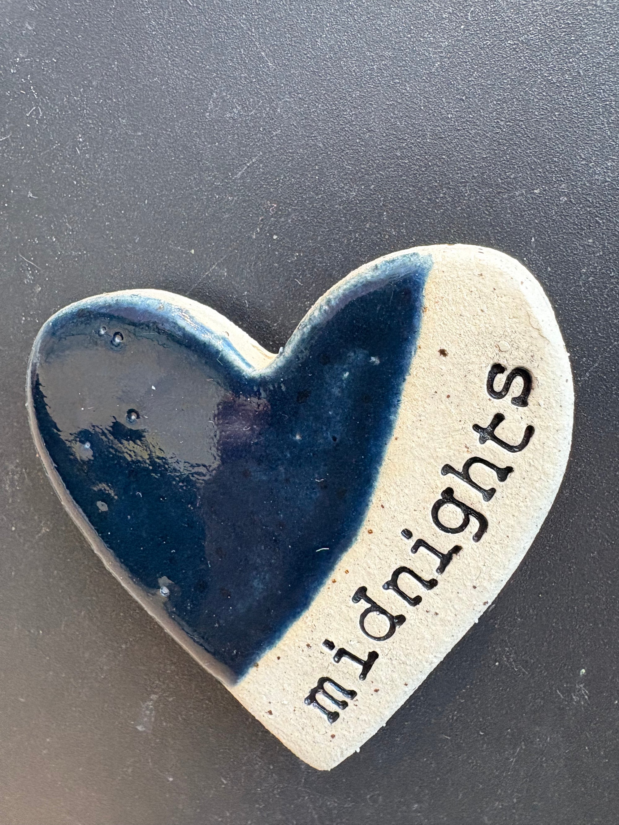 Twelve heart shaped Taylor Swift album magnets