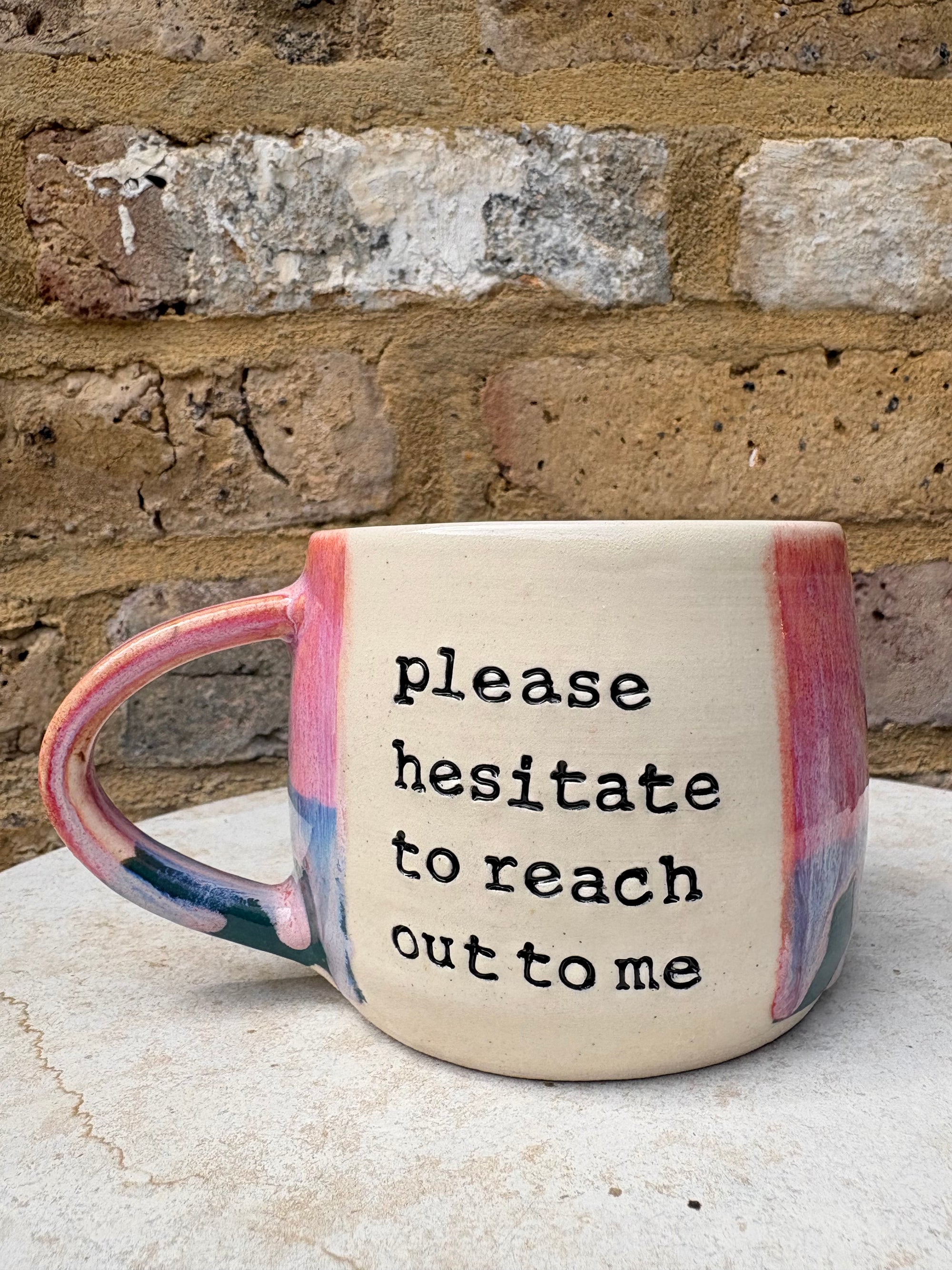 "please hesitate to reach out to me" mug (pink/green)