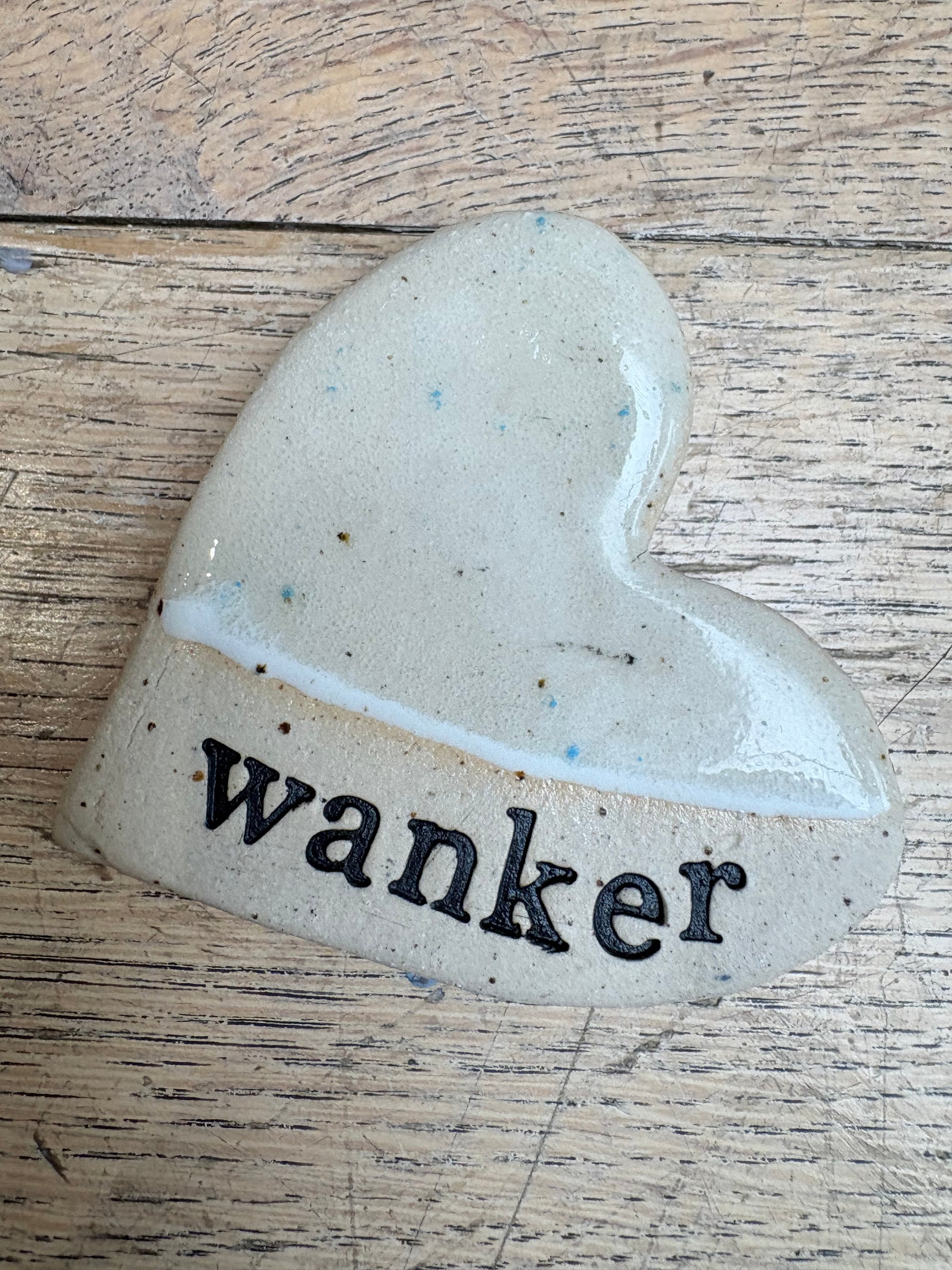 “wanker” Magnet (beige, large)