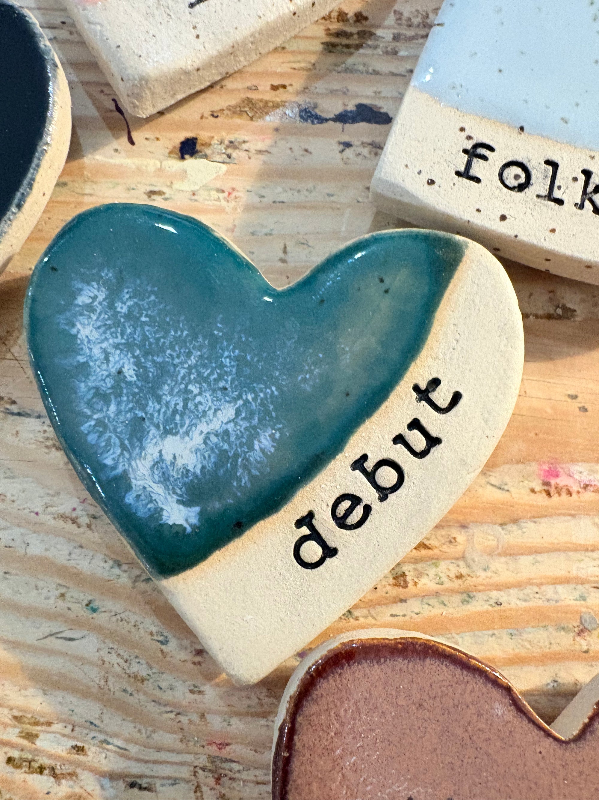 Twelve heart shaped Taylor Swift album magnets