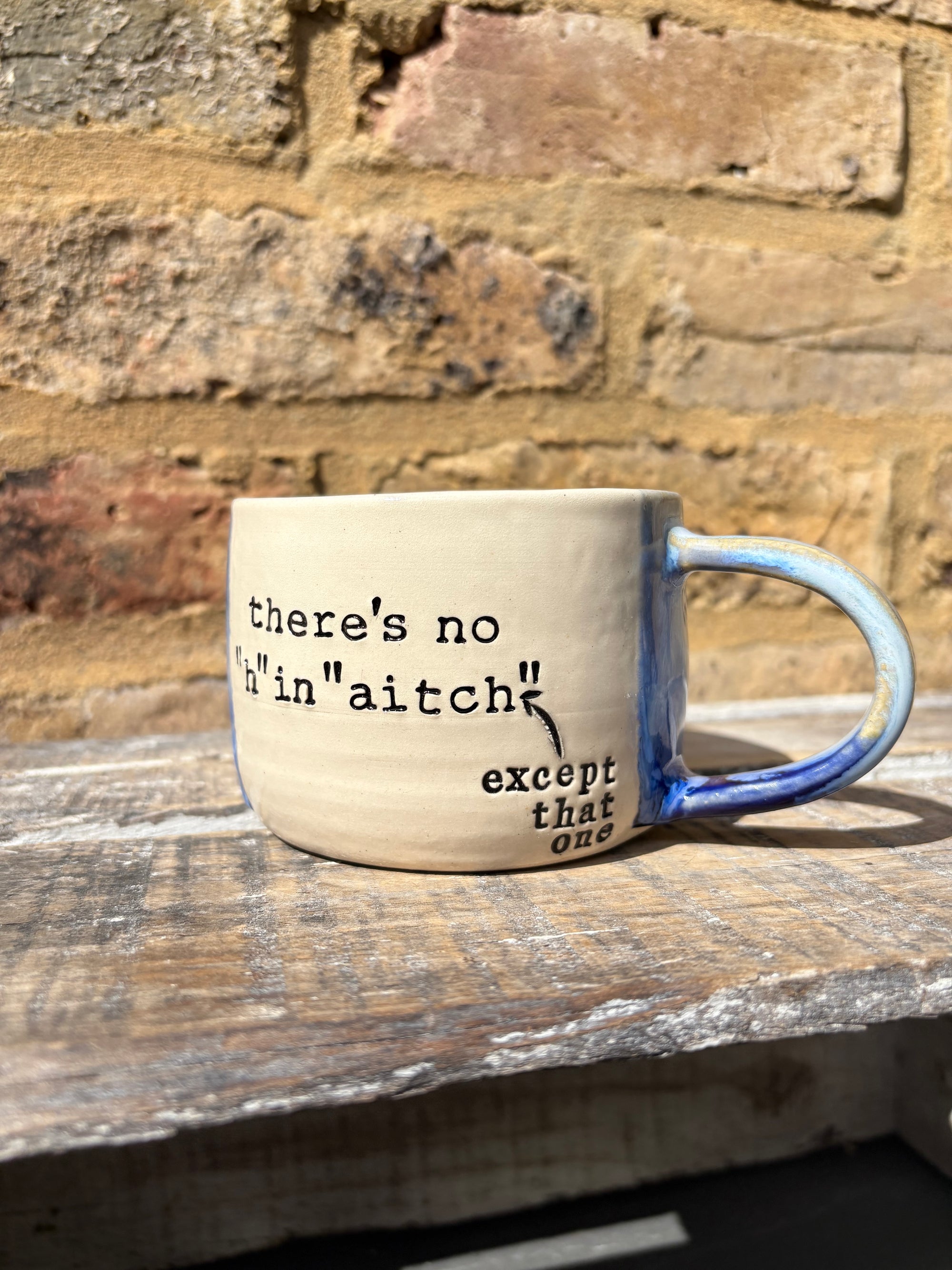 ""there's no "h" in "aitch" except that one" mug (blues)