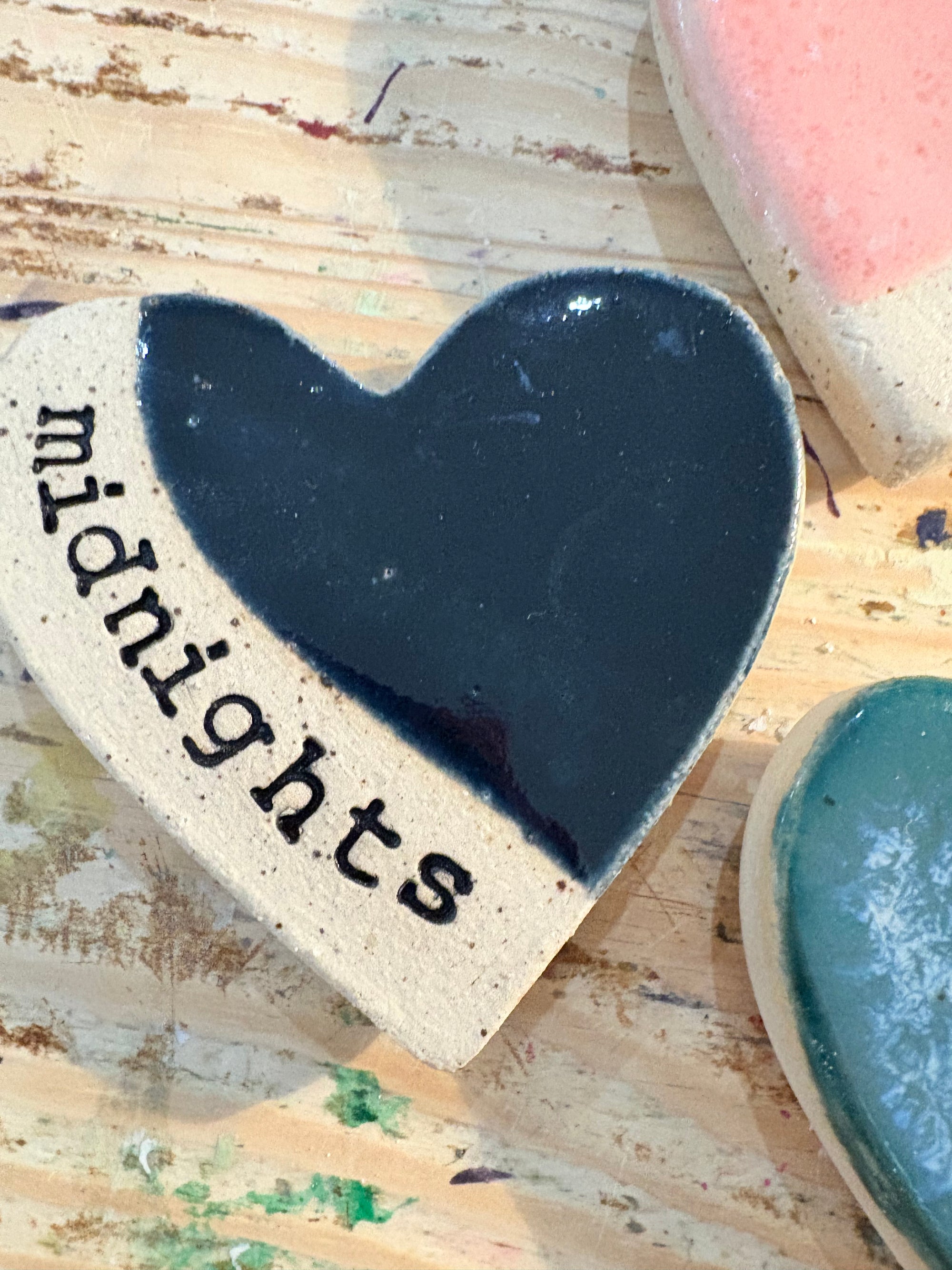 Twelve heart shaped Taylor Swift album magnets