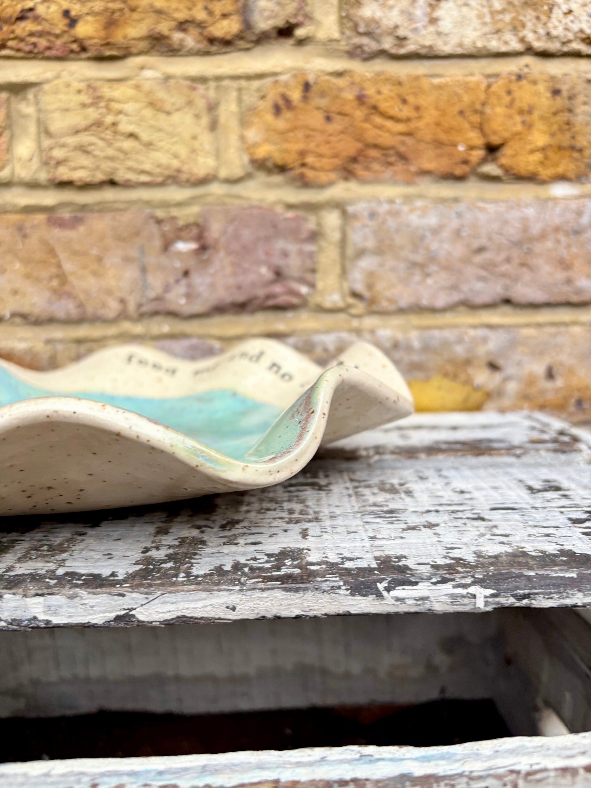 "feed me and no one gets hurt"  serving dish