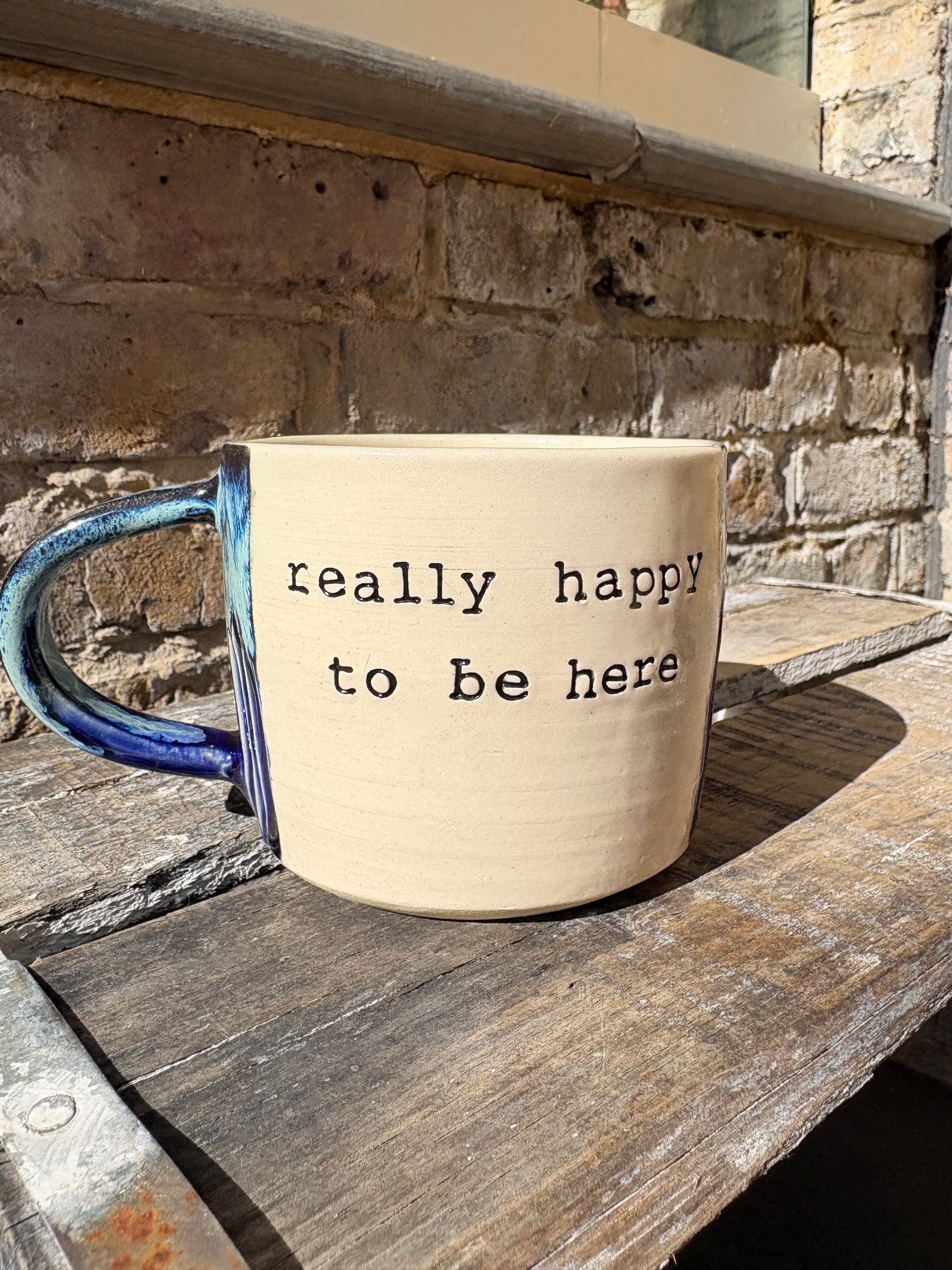 "really happy to be here” "what a bunch of cunts" mug (medium, blue shore)