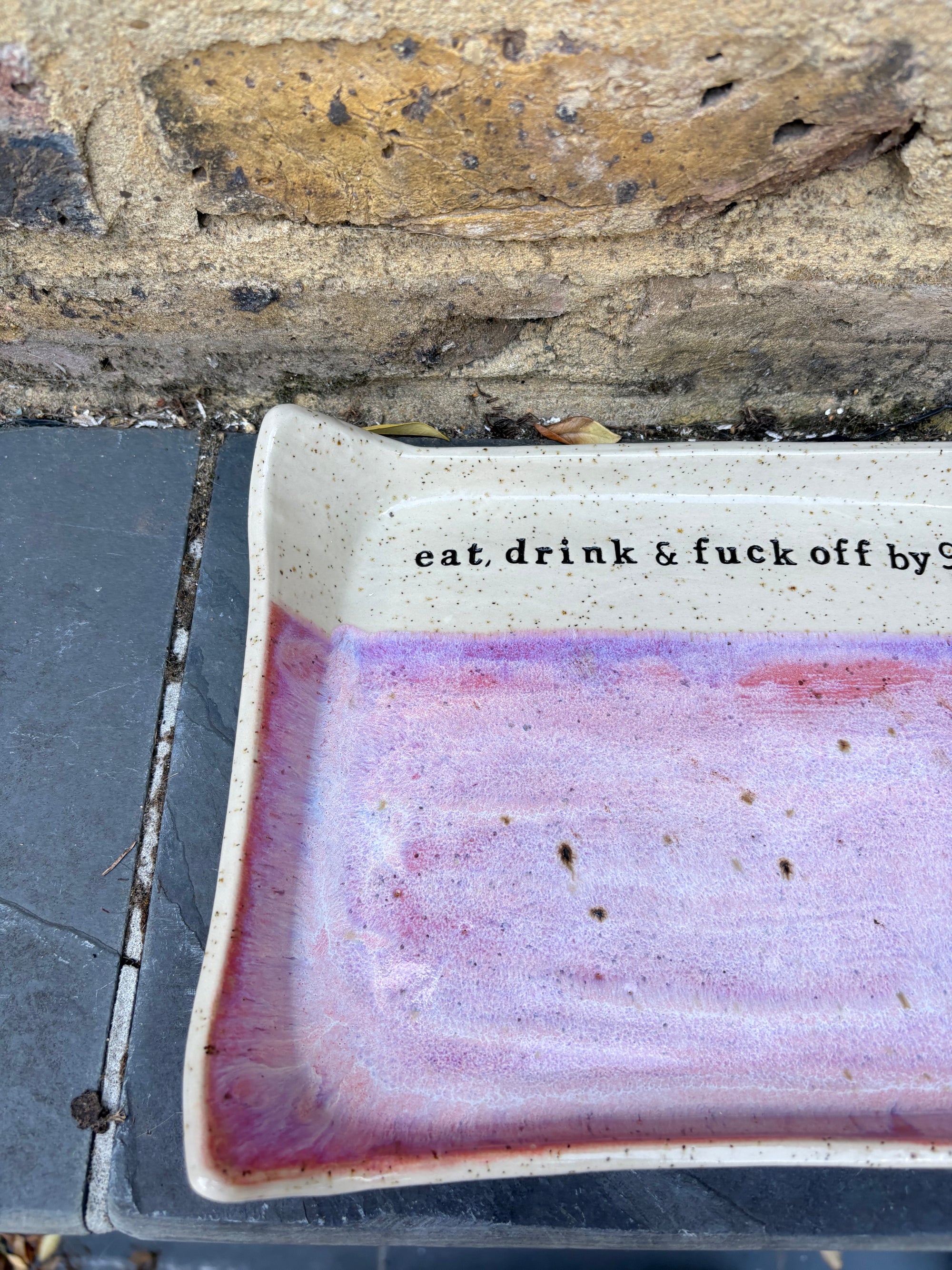 “eat, drink and fuck off by 9pm" rectangular dish (pink, flecked clay)