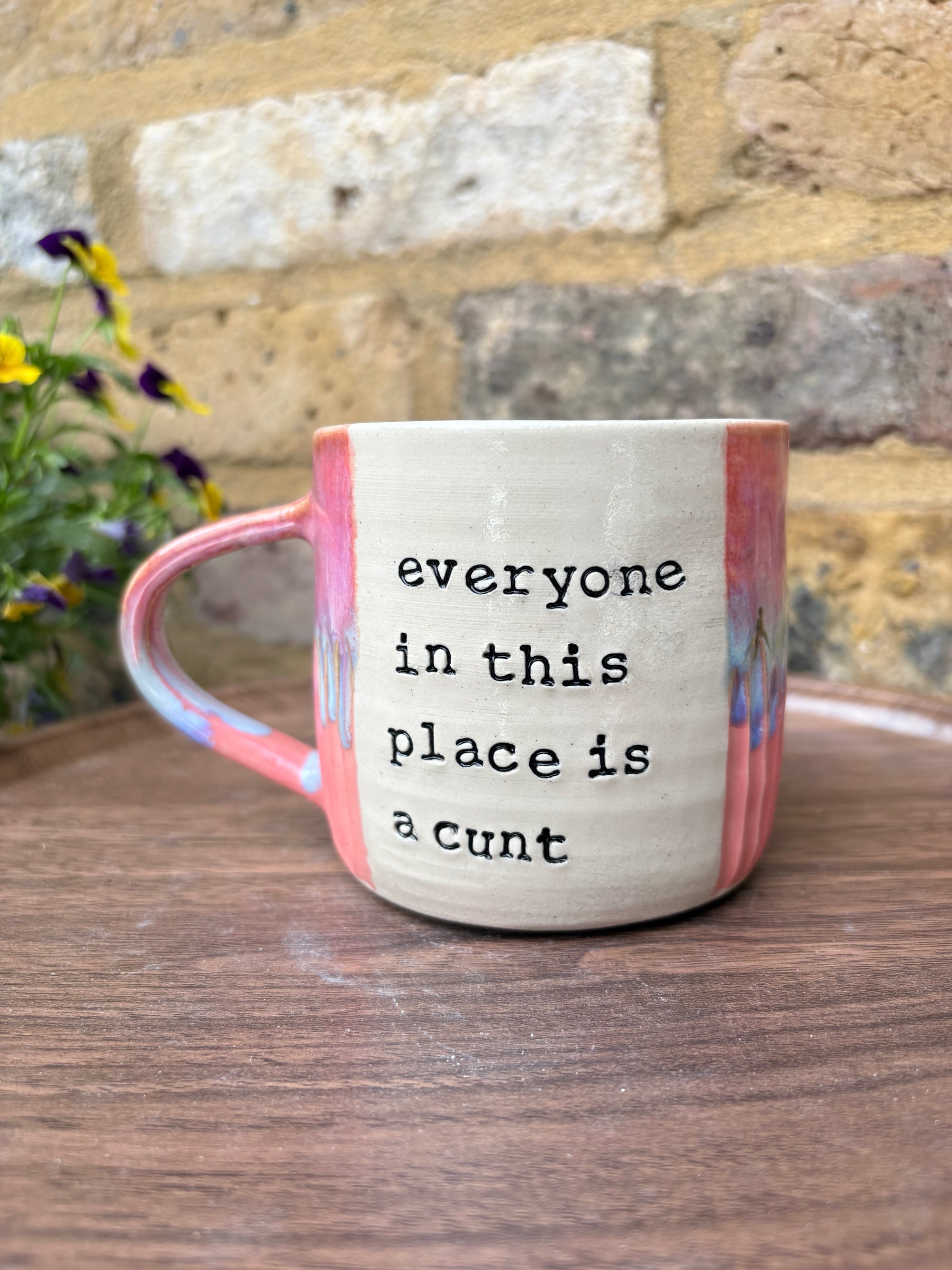 "I 🩷 WORK” "everyone in this place is a cunt" mug (pinks, left)