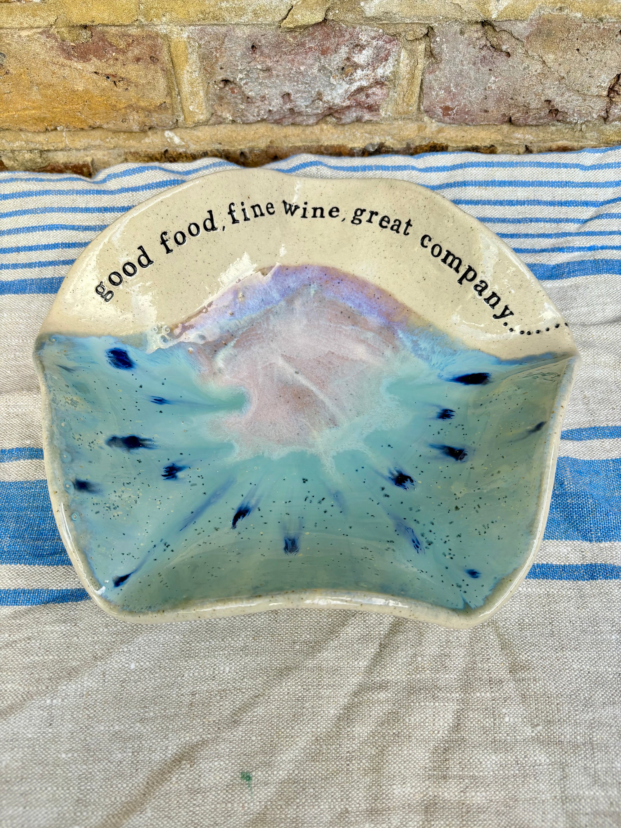 "good food, fine wine, great company..." serving dish