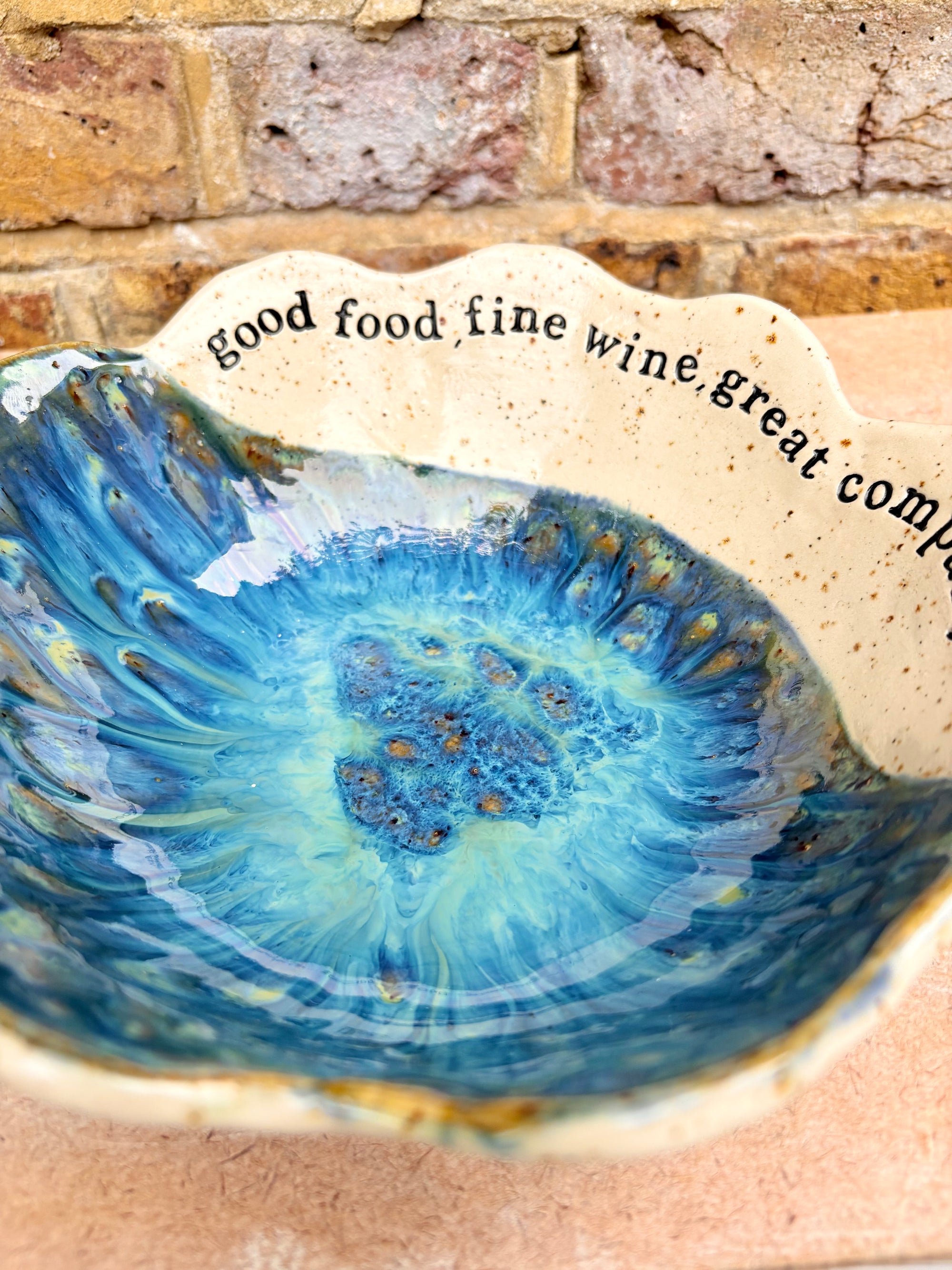 "good food, fine wine, great company..." deep salad/serving dish