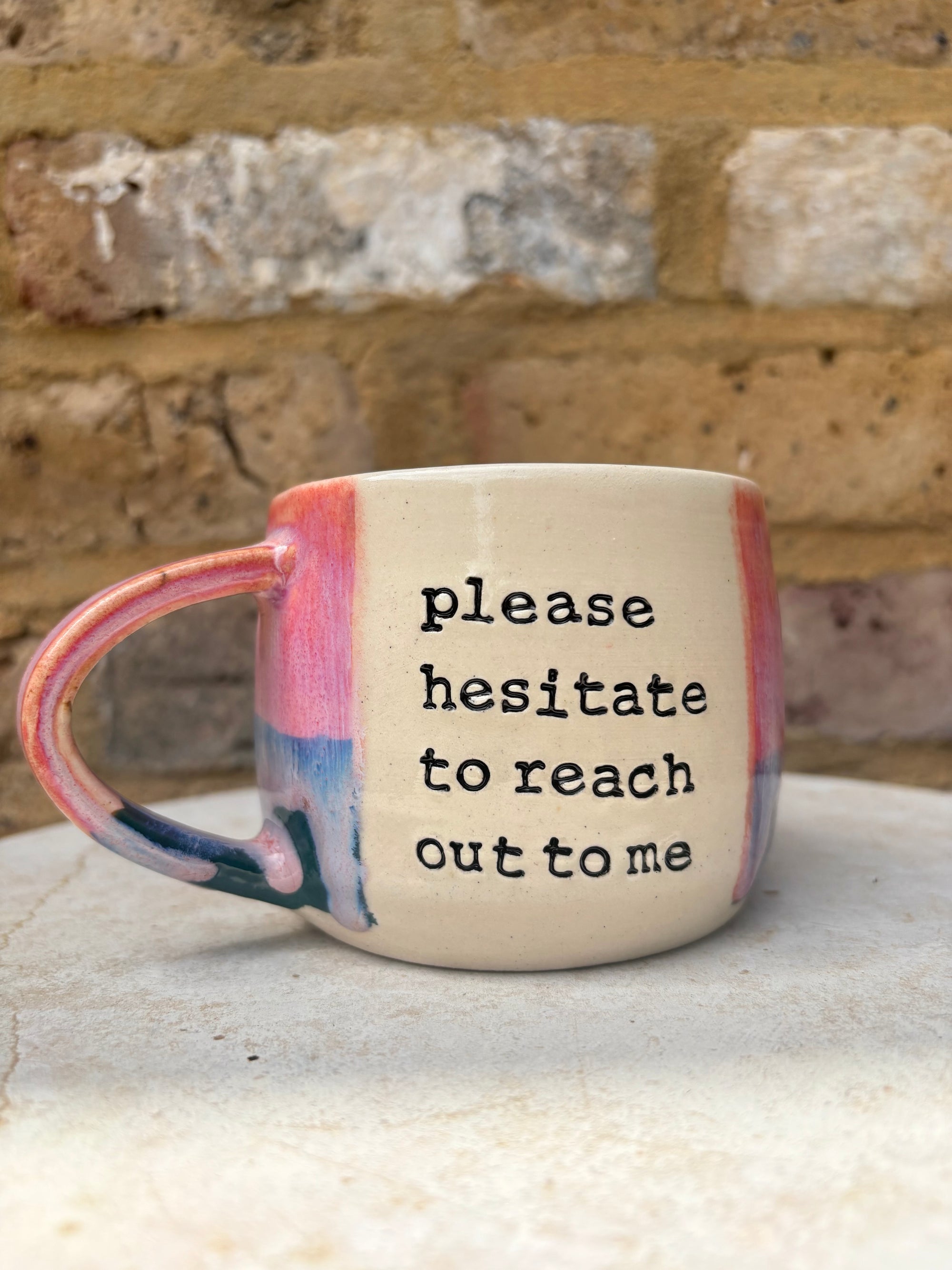 "please hesitate to reach out to me" mug (pink/green)