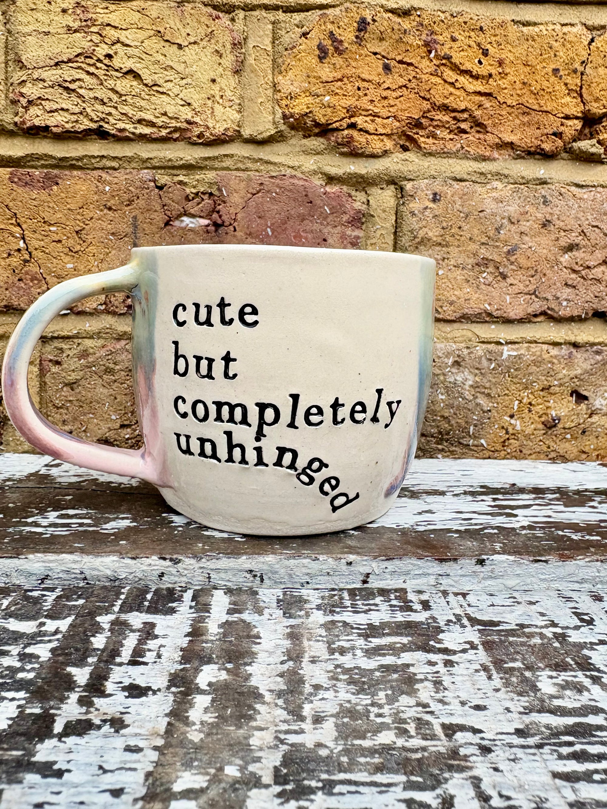 "cute but completely unhinged" mug
