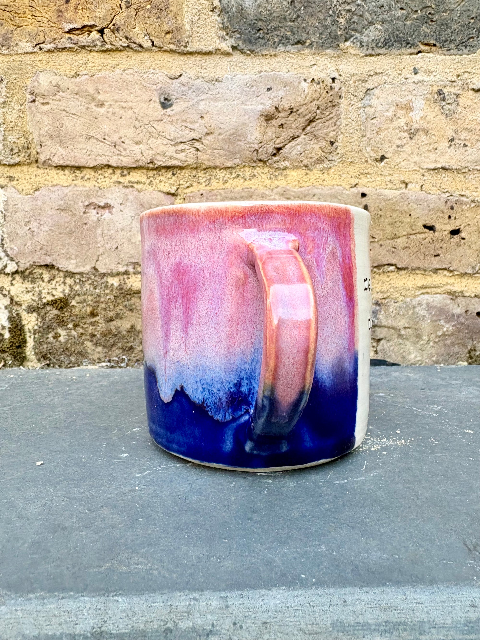 "really happy to be here” "what a bunch of cunts" mug (pink/blue)